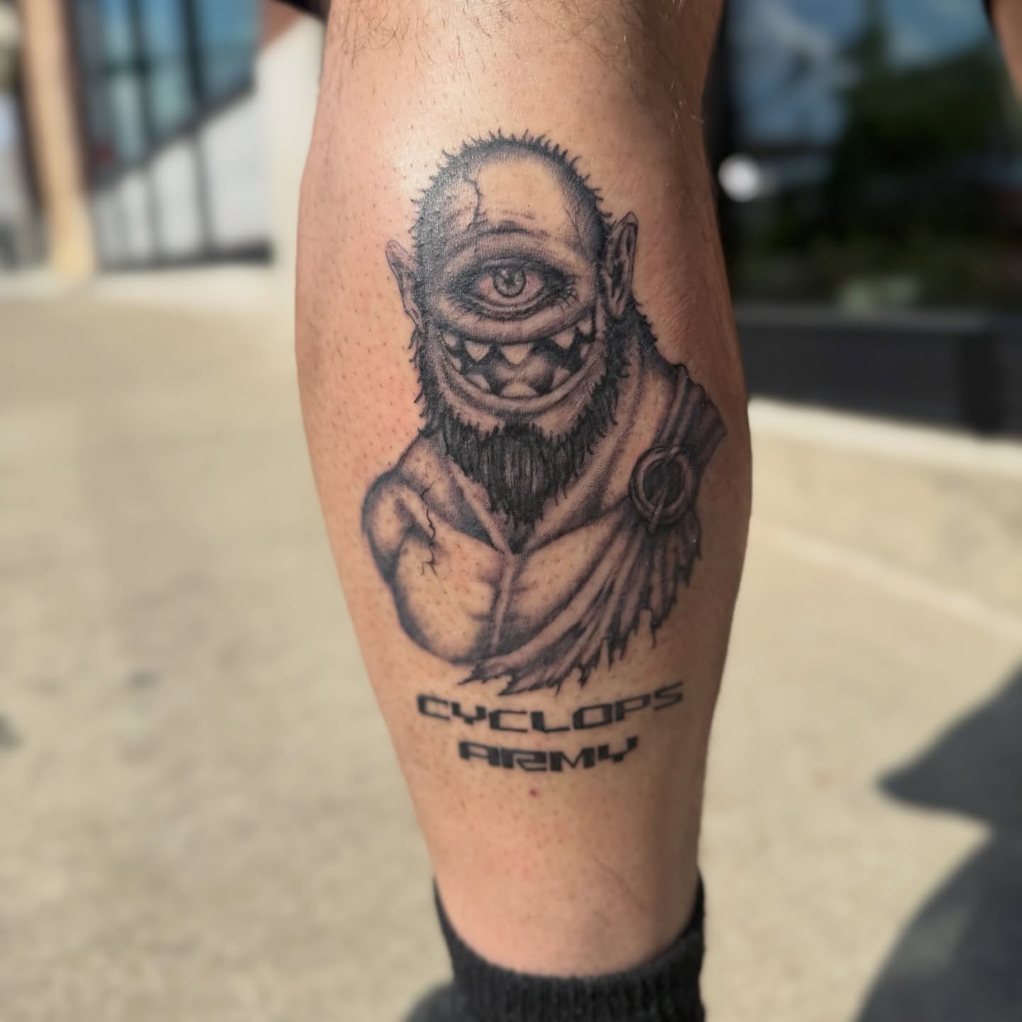 Cyclops black and grey tattoo on the forearm by Chuckthegirl