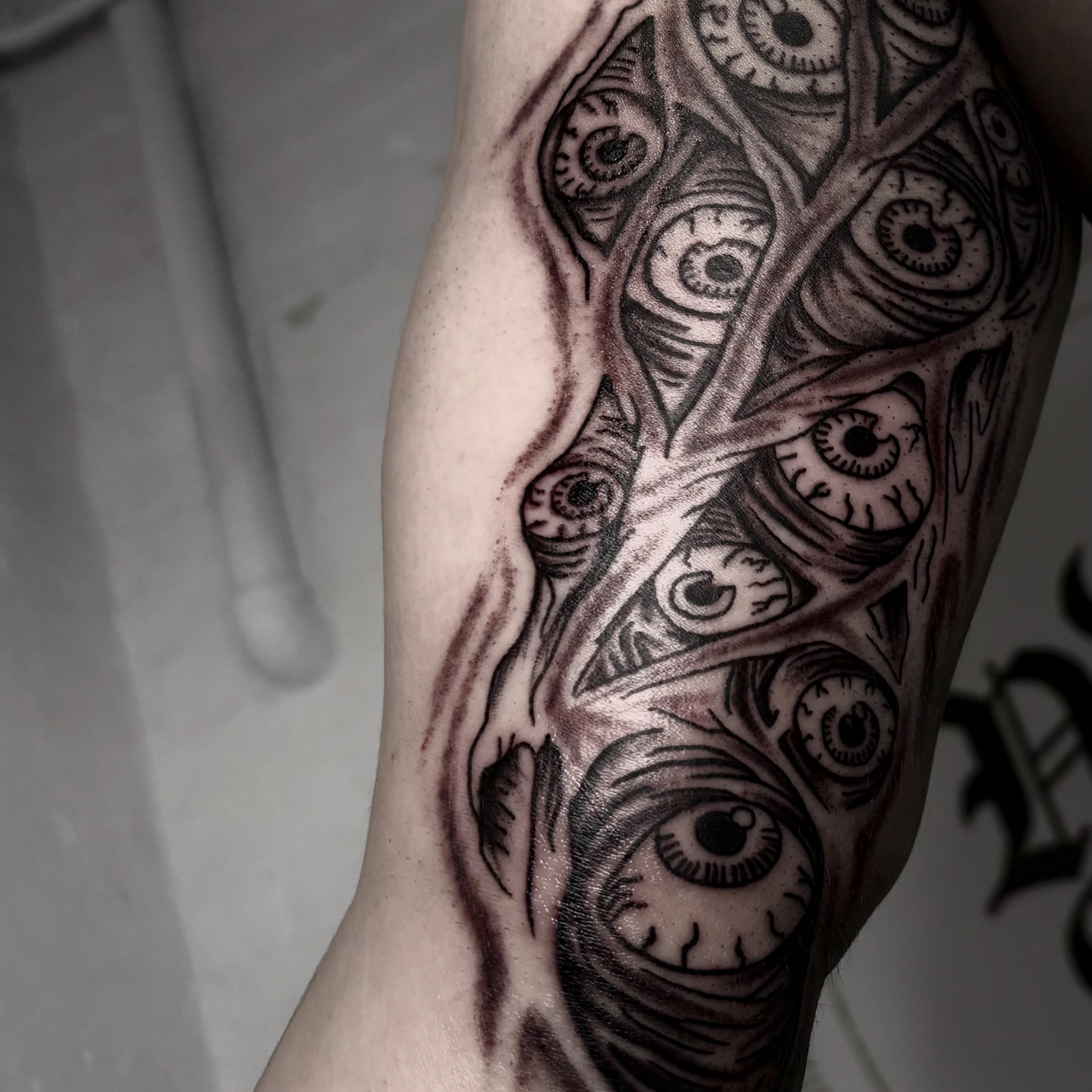 Eyes realism tattoo on the forearm by Landon Bagley