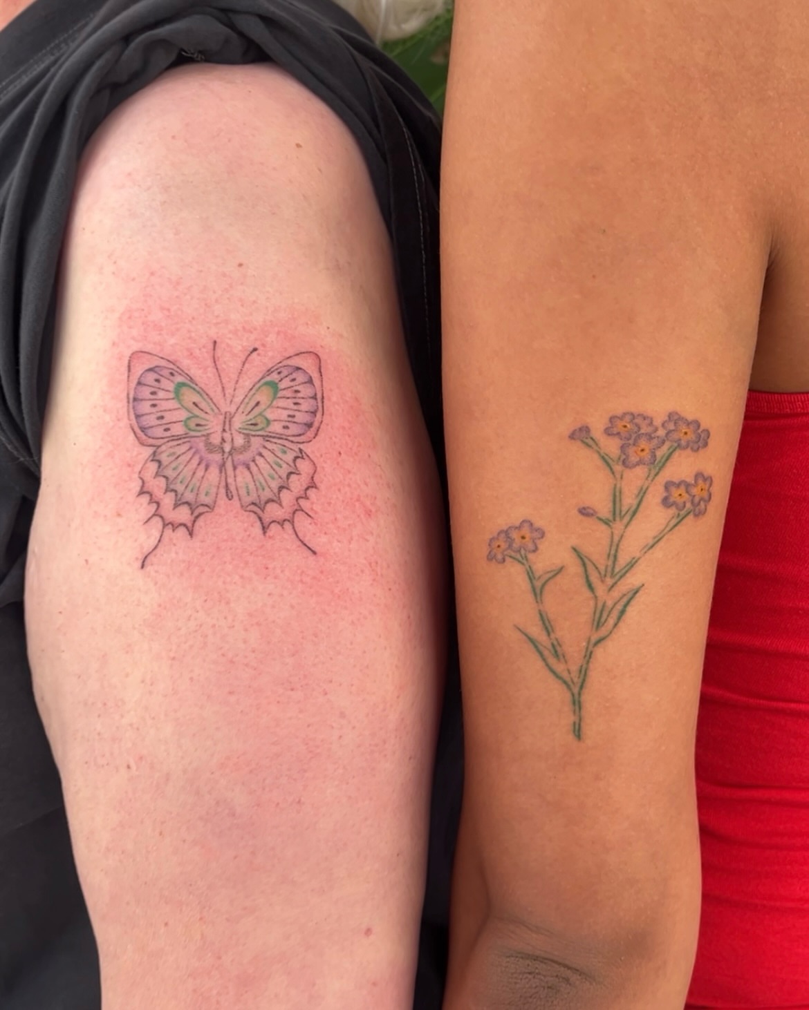 Butterfly and flowers dotwork tattoo on the upper arm by mia