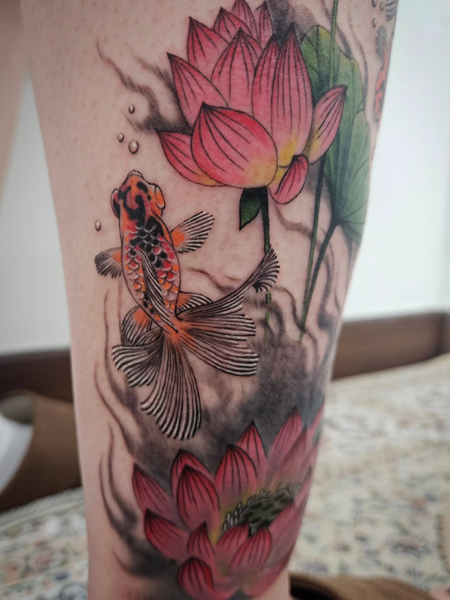 Lotus and koi fish japanese irezumi tattoo on the forearm by Tattooer Hermin 허민