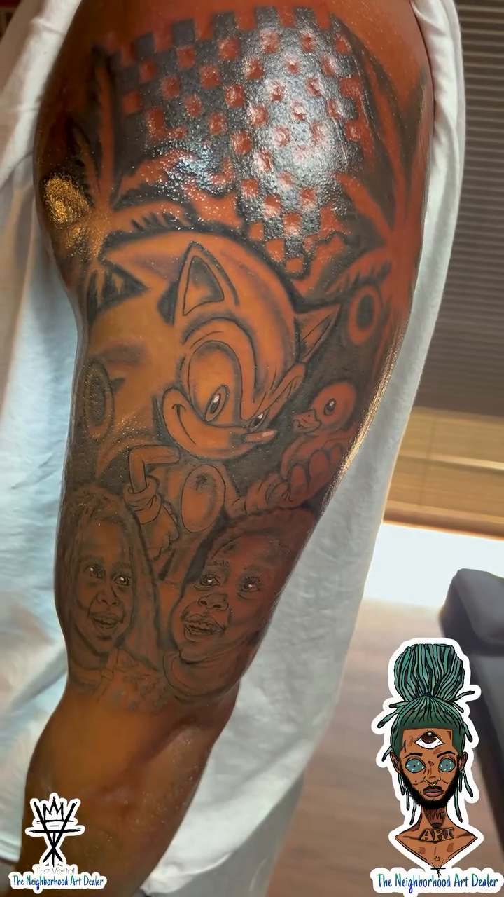 Sonic the Hedgehog and portraits realism tattoo on the upper arm by The Neighborhood Art Dealer™️
