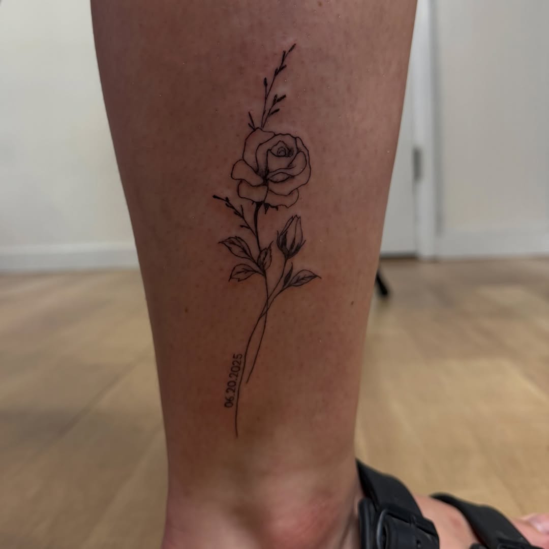 Rose fine line tattoo on the calf by TolzinInk, Brookings, South Dakota