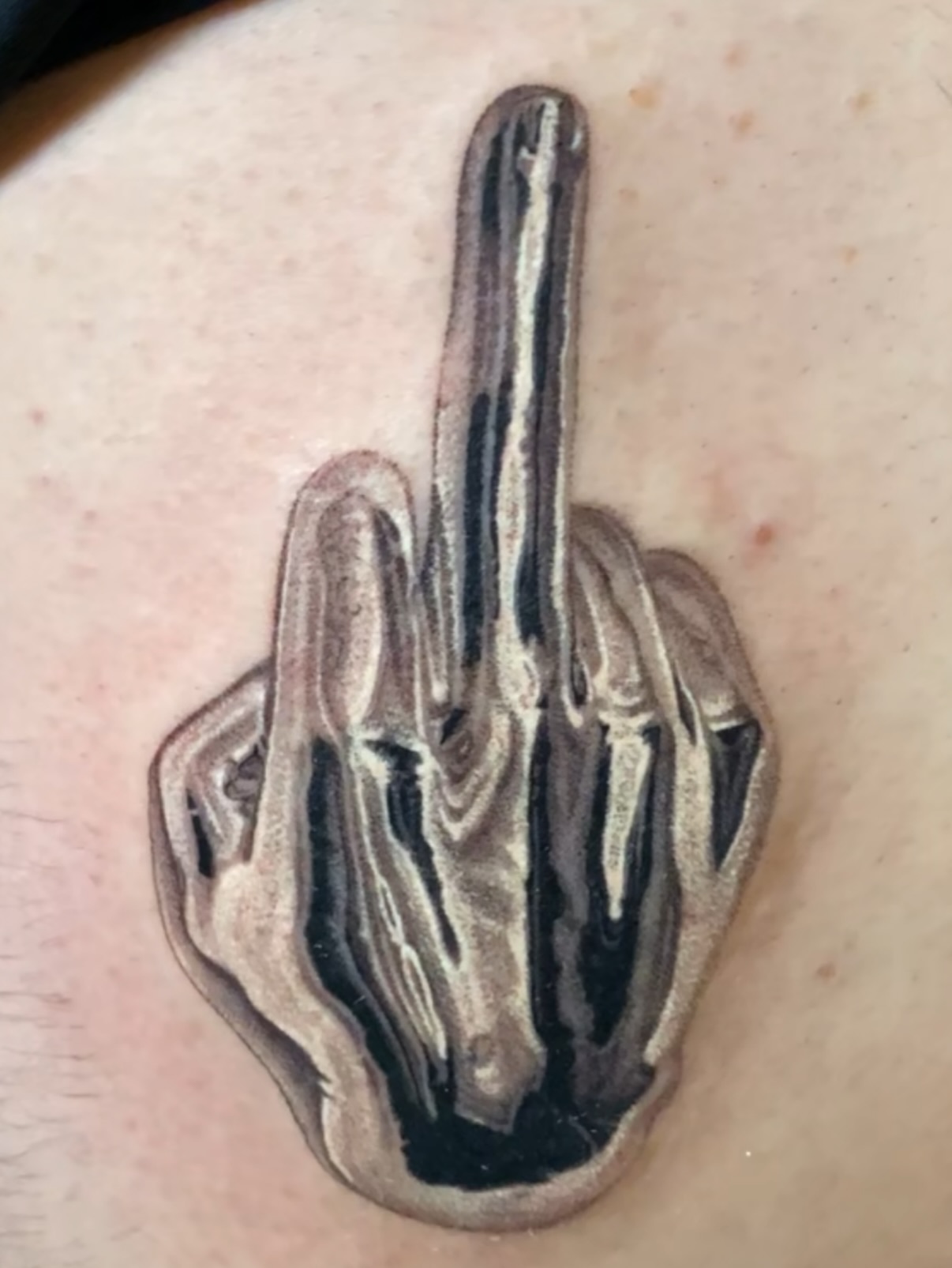 Middle finger black and grey tattoo by Dan Sprague