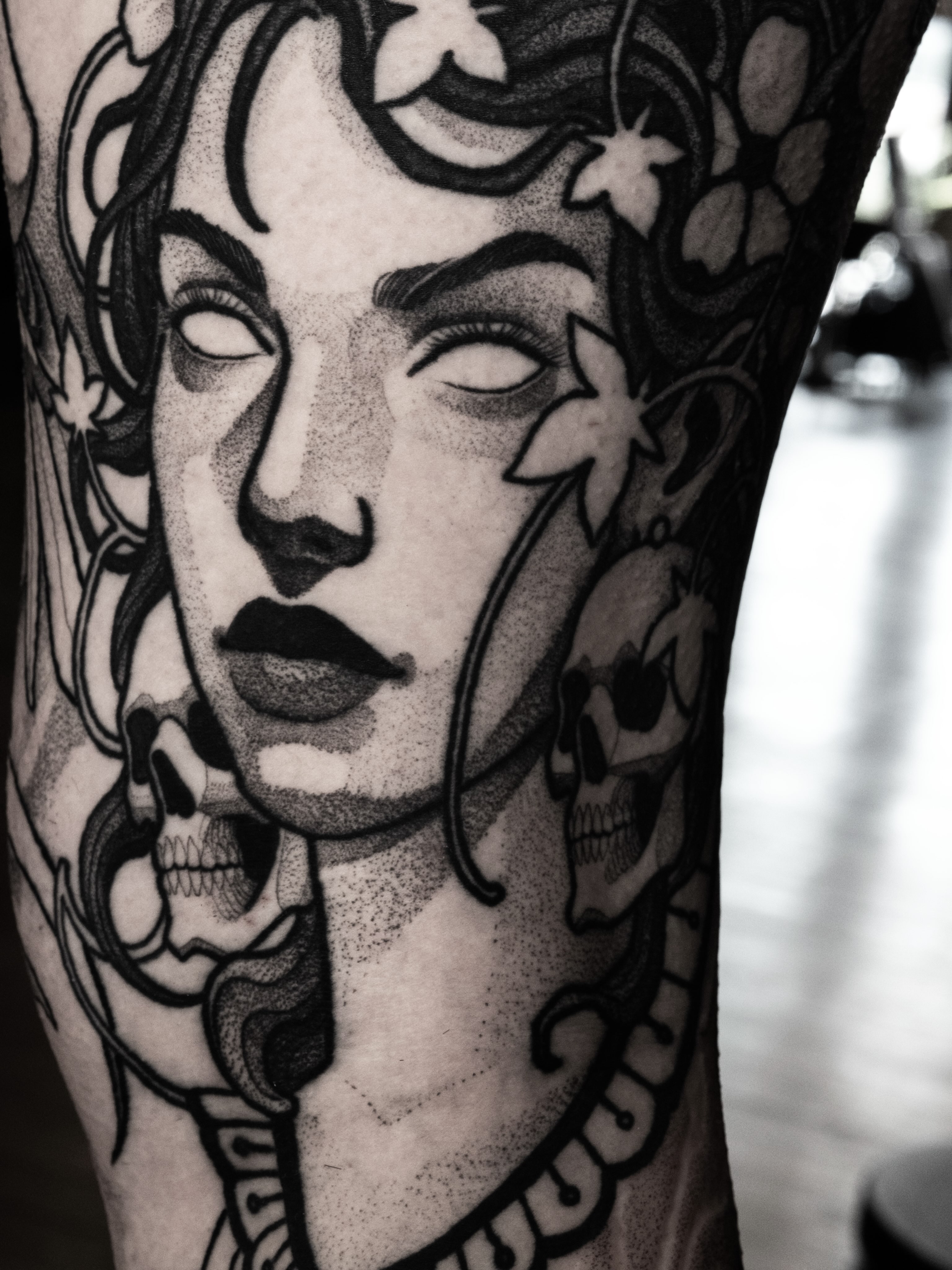 Woman's face dotwork tattoo on the forearm by Craig St Peter, Kansas City, Missouri