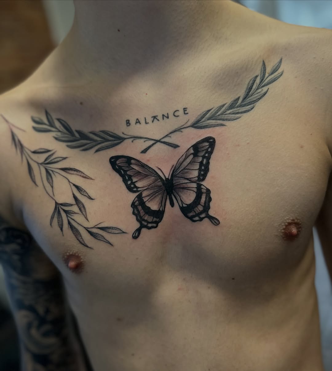 Butterfly black and grey tattoo on the chest by Inked By E, Philadelphia, Pennsylvania