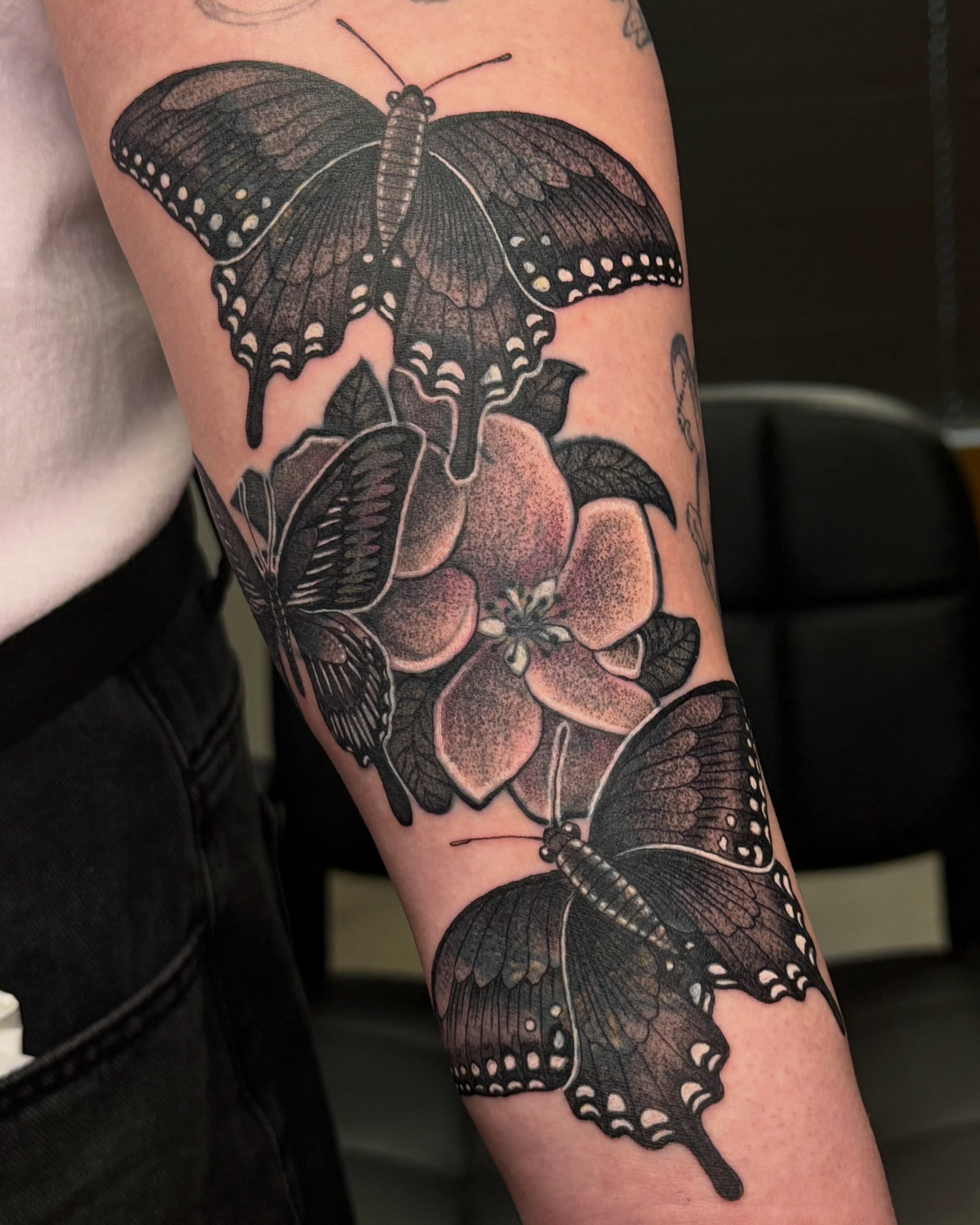 Butterflies and flower realism tattoo on the forearm by Christian