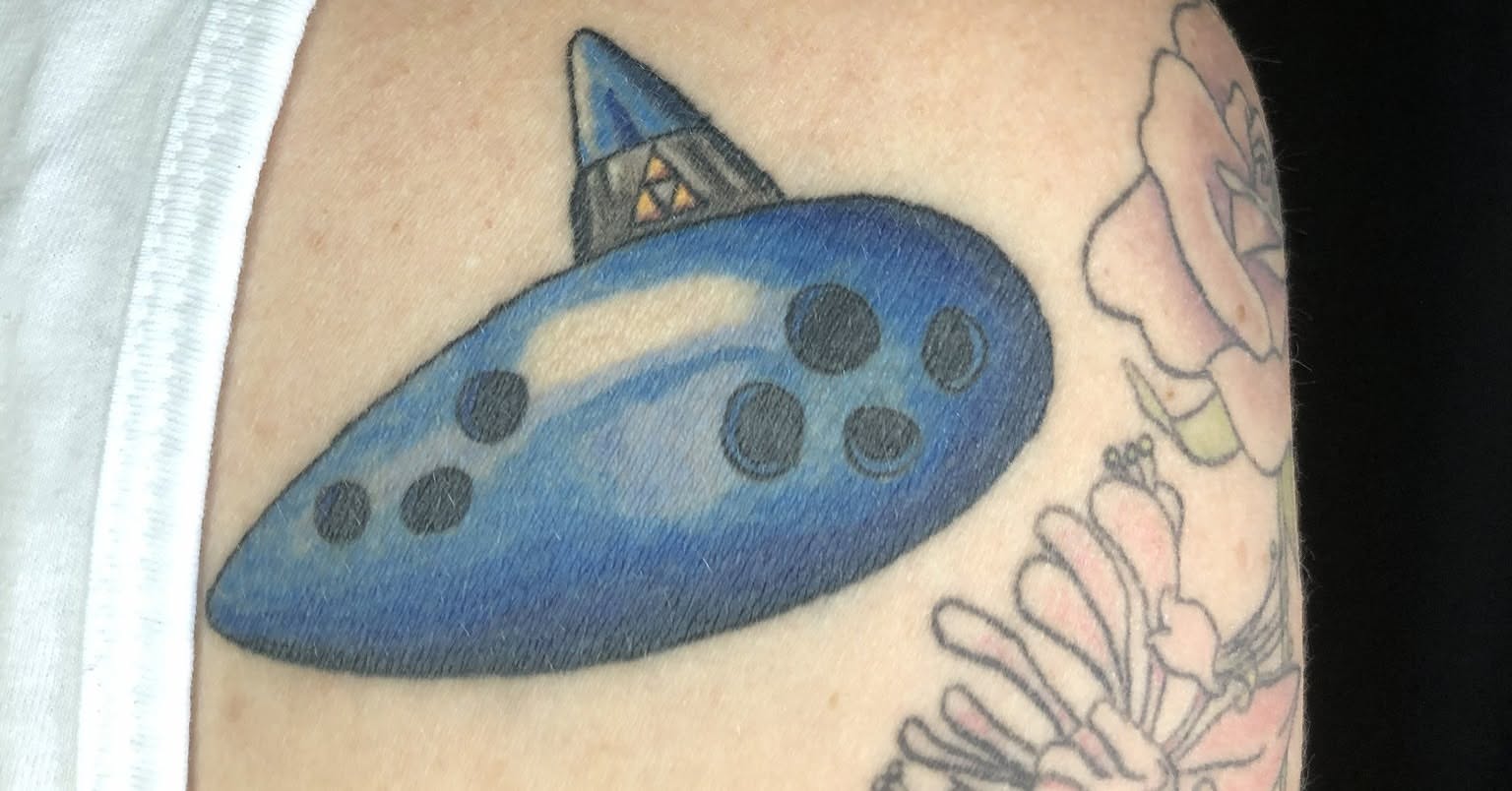 Spacecraft dotwork tattoo on the upper arm by Rowan Lee
