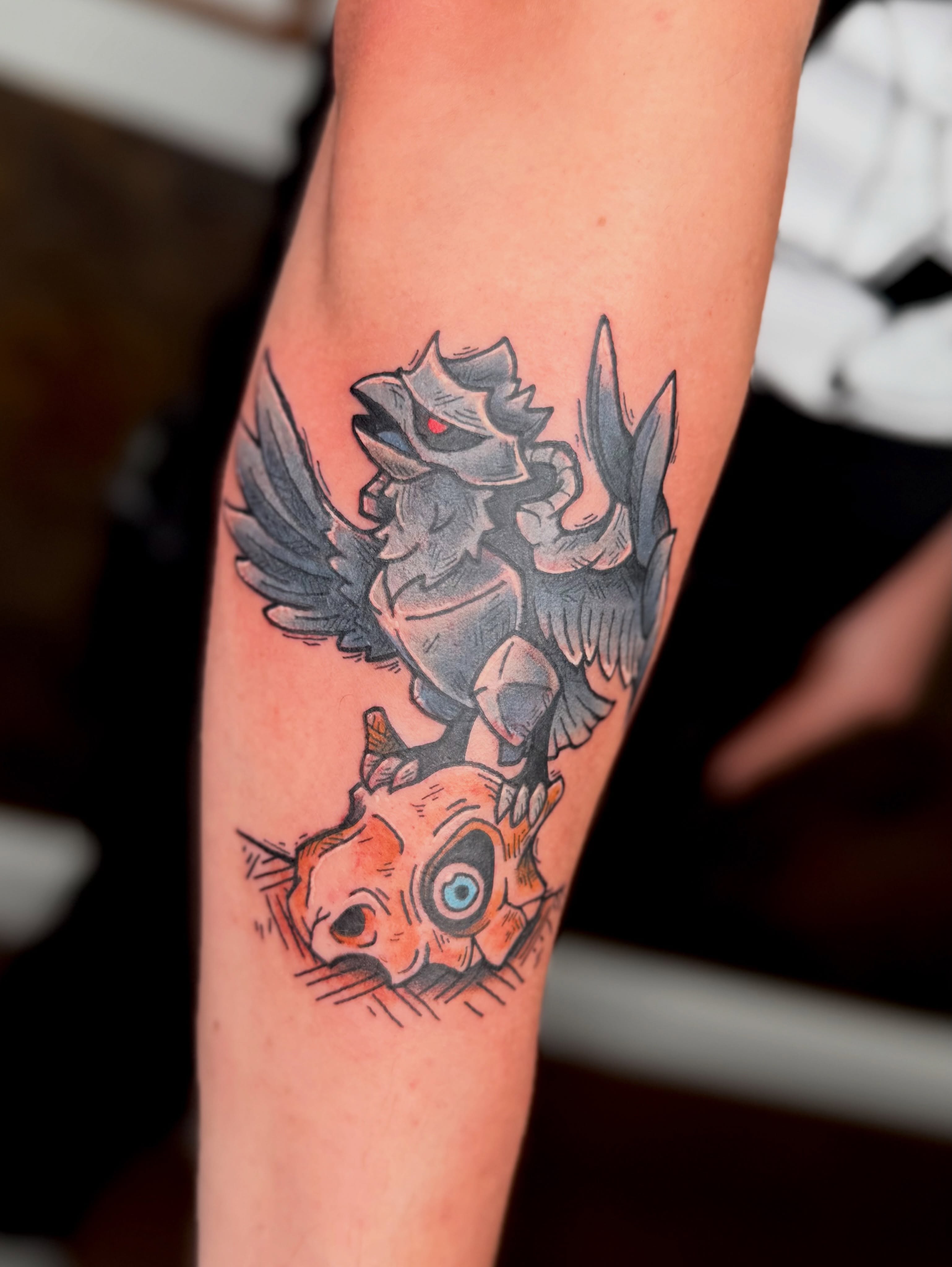 Bird and skull American traditional tattoo on the forearm by Jezza Munson