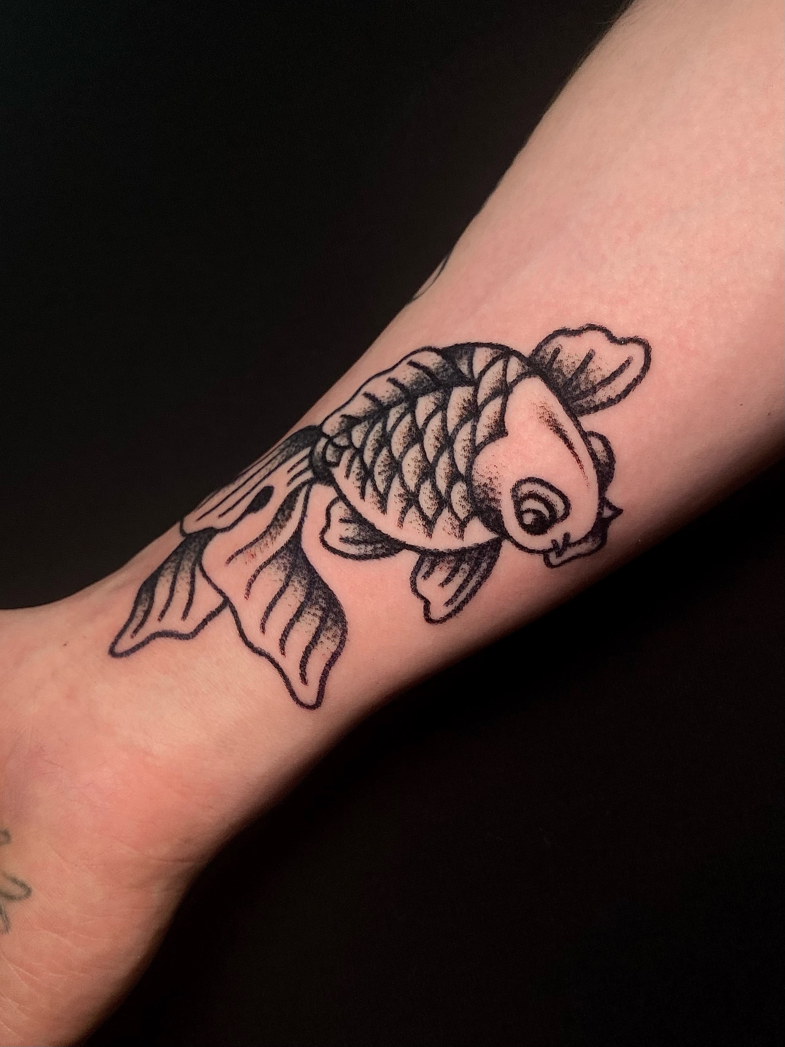 Koi fish black and grey tattoo on the forearm by Daniel Diego
