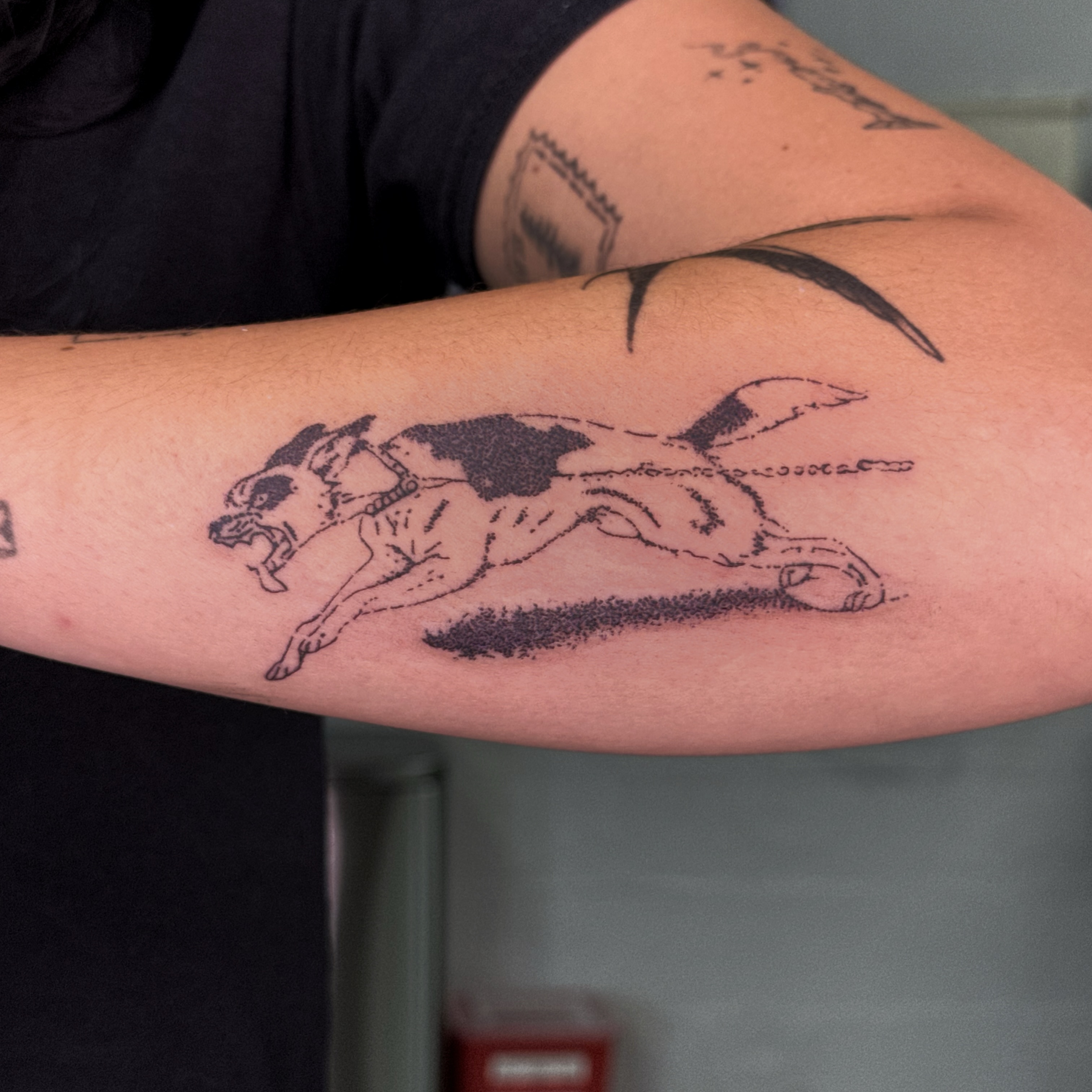 Horse and rider black and grey tattoo on the forearm by Joint Killer