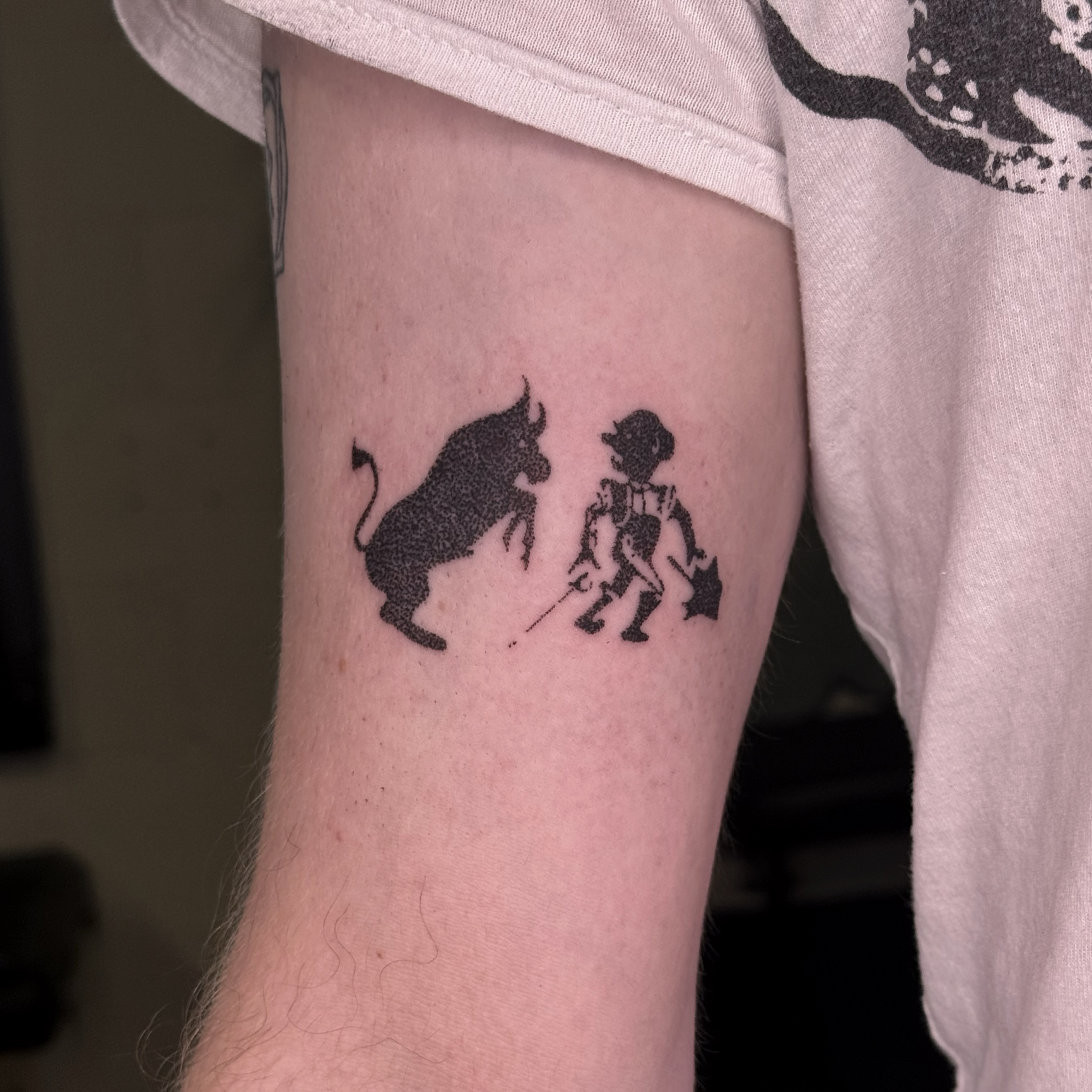 Bull and boy dotwork tattoo on the forearm by Joint Killer