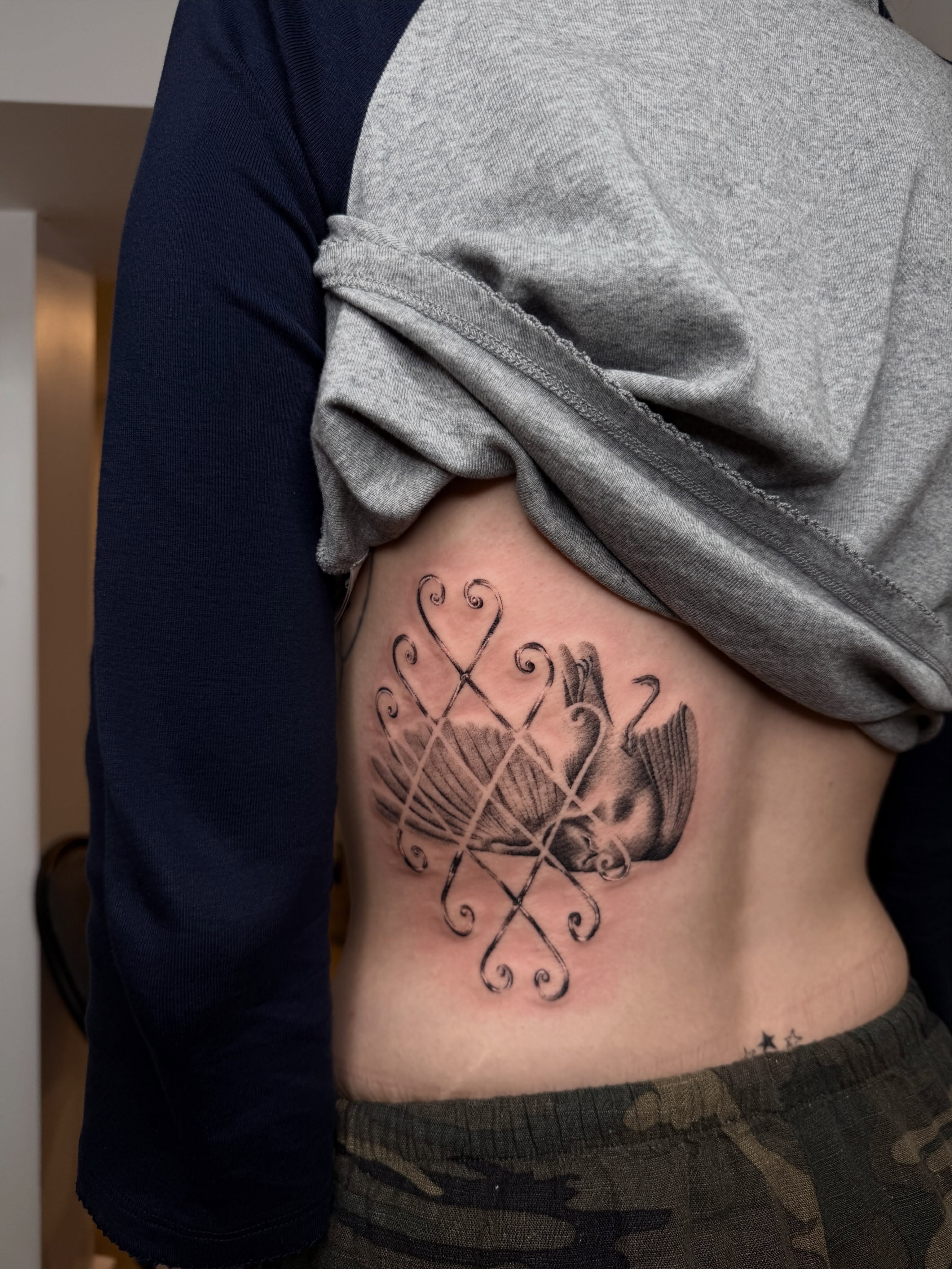 Bird and abstract patterns realism tattoo on the ribs by 🗡Addie Kat🗡