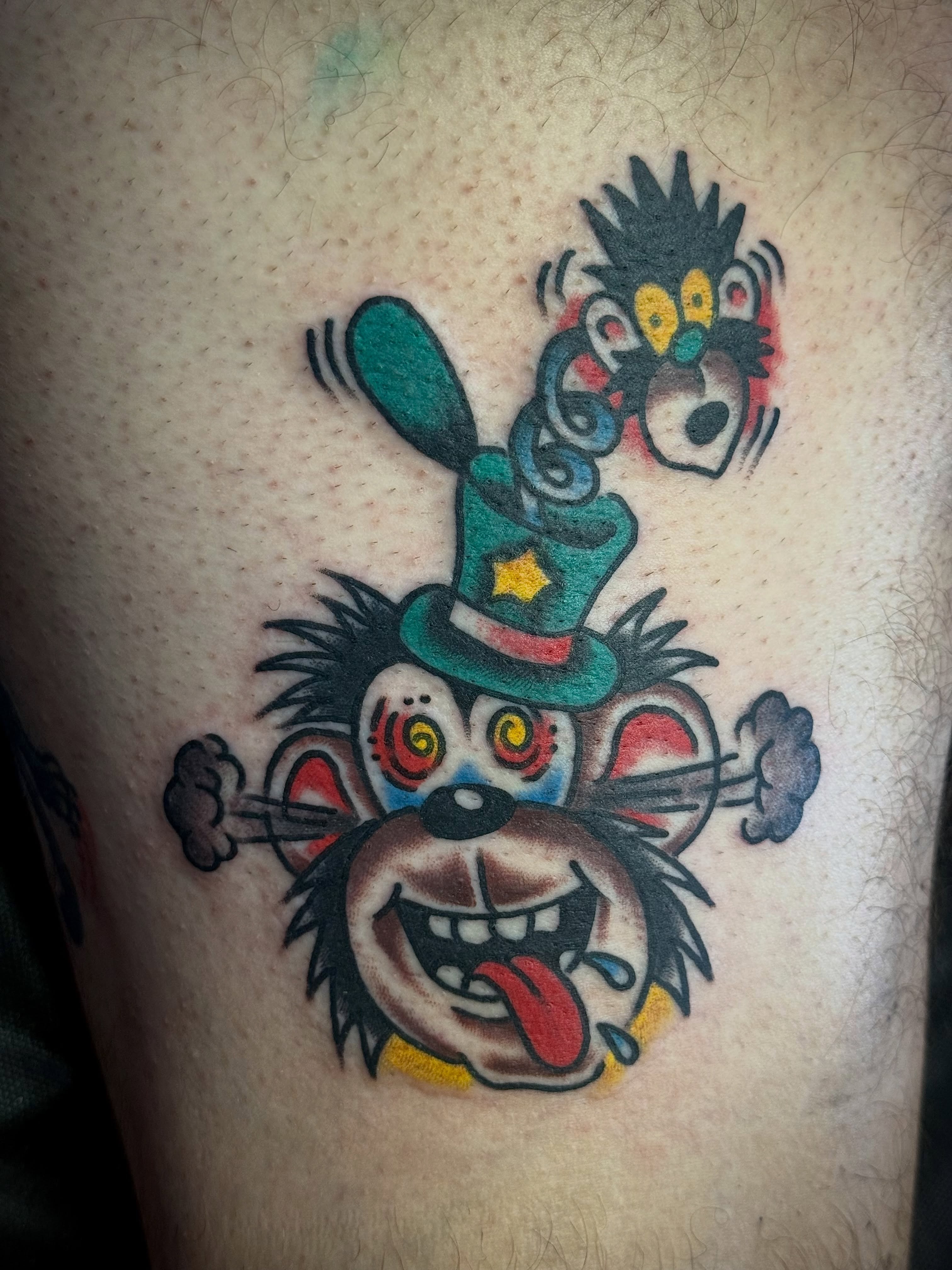 Jester rat American traditional tattoo on the thigh by Chuck Derek Whitaker