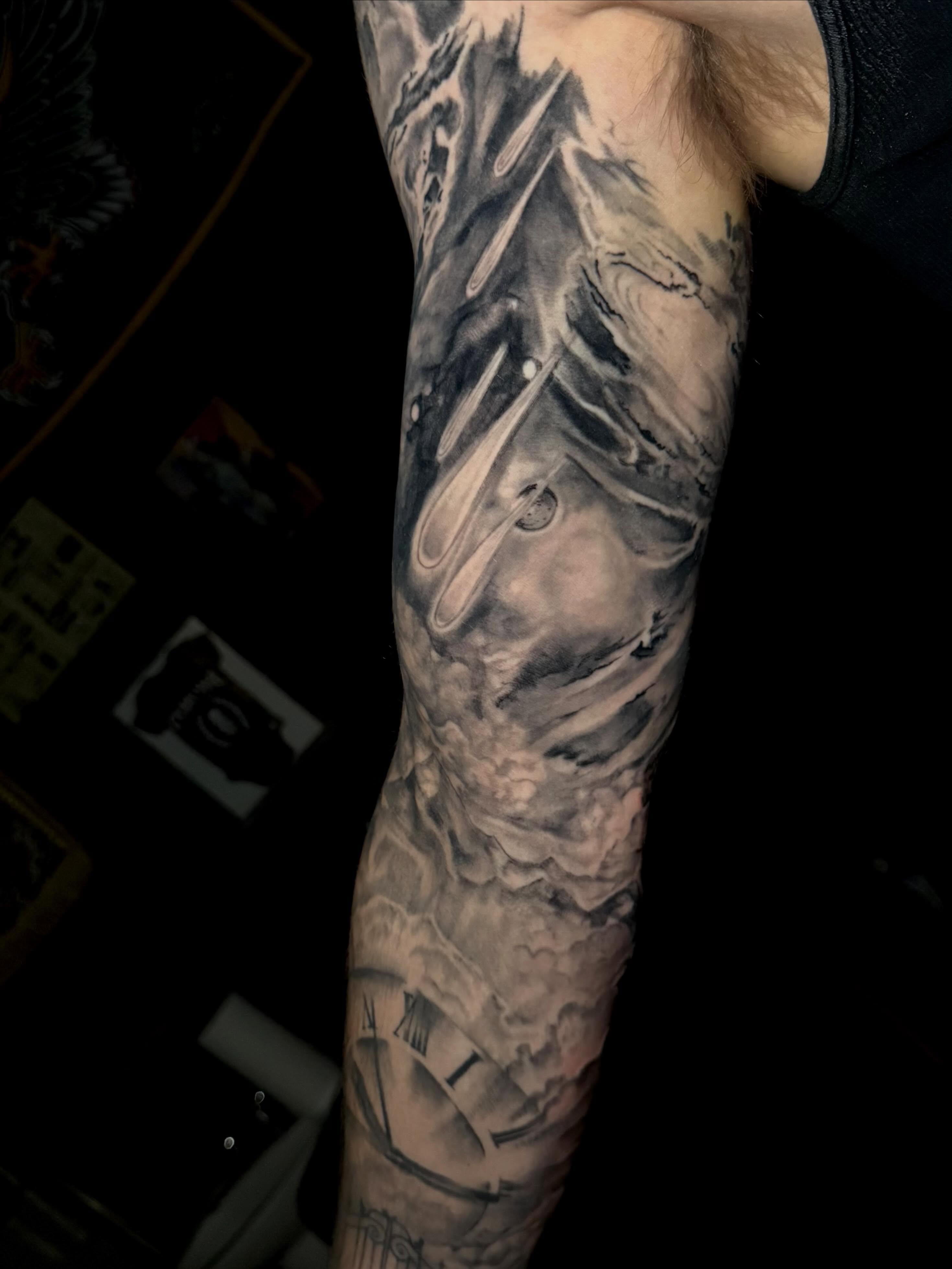 Abstract landscape realism tattoo on the forearm by Aaron Ysidro