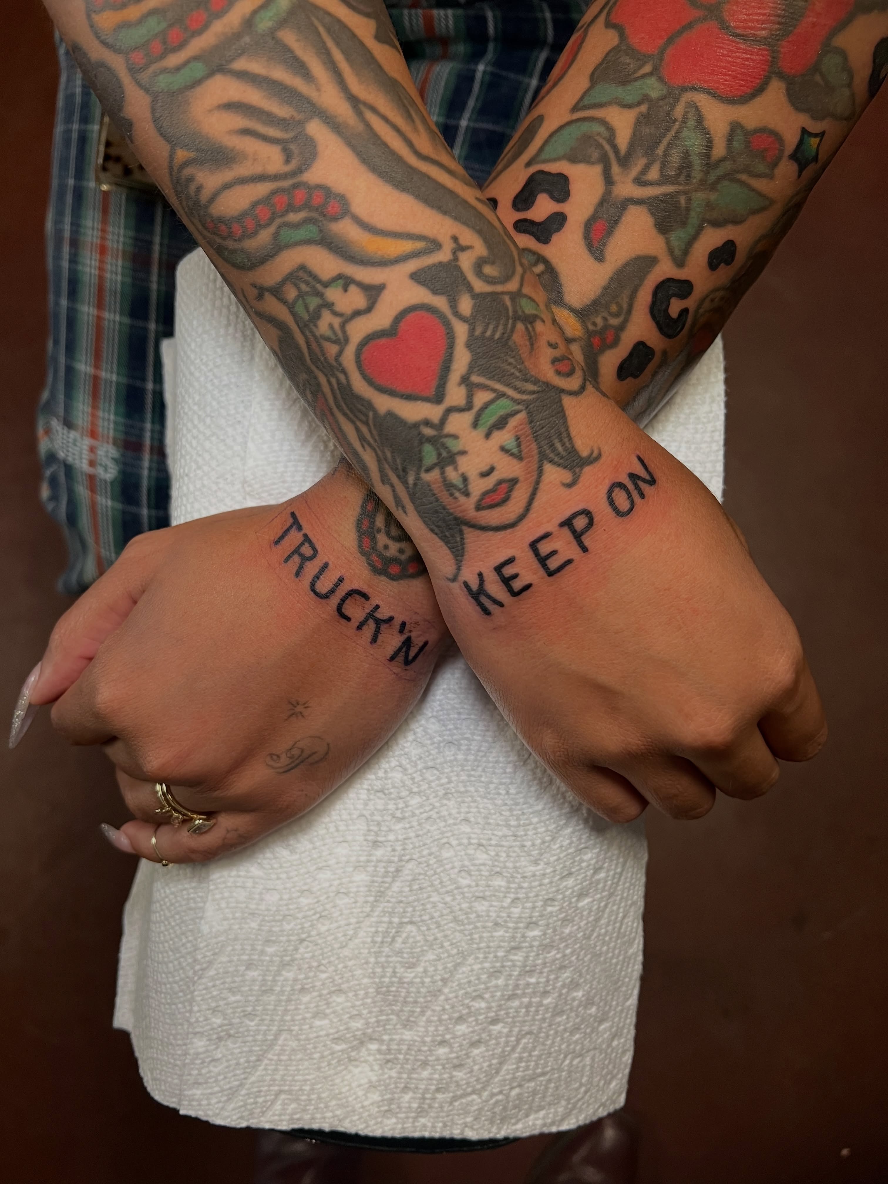 Tattooed lettering American traditional tattoo on the forearm by Nestor Zelaya