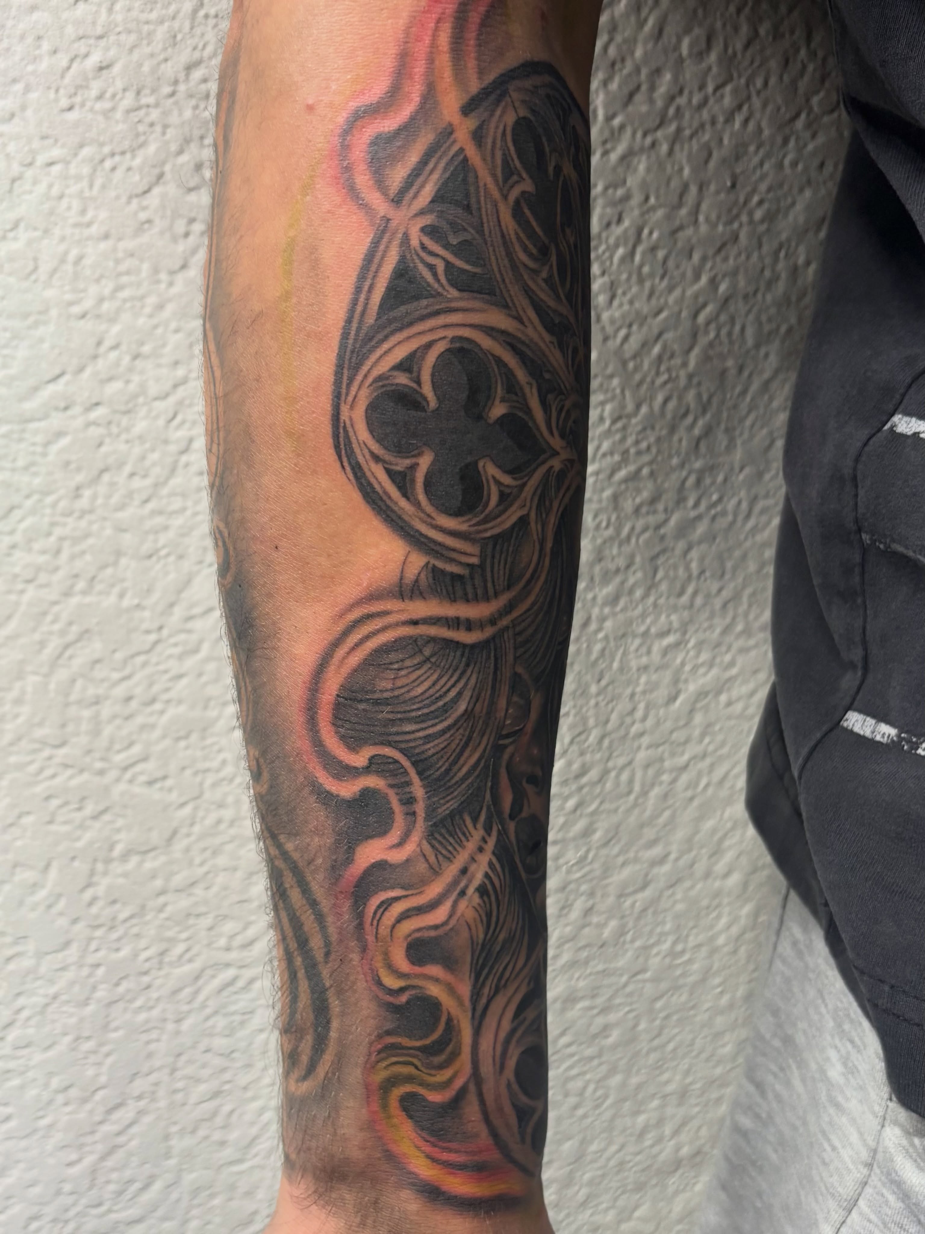 Flame and ornamental pattern geometric tattoo on the forearm by @tattoosbyadrian