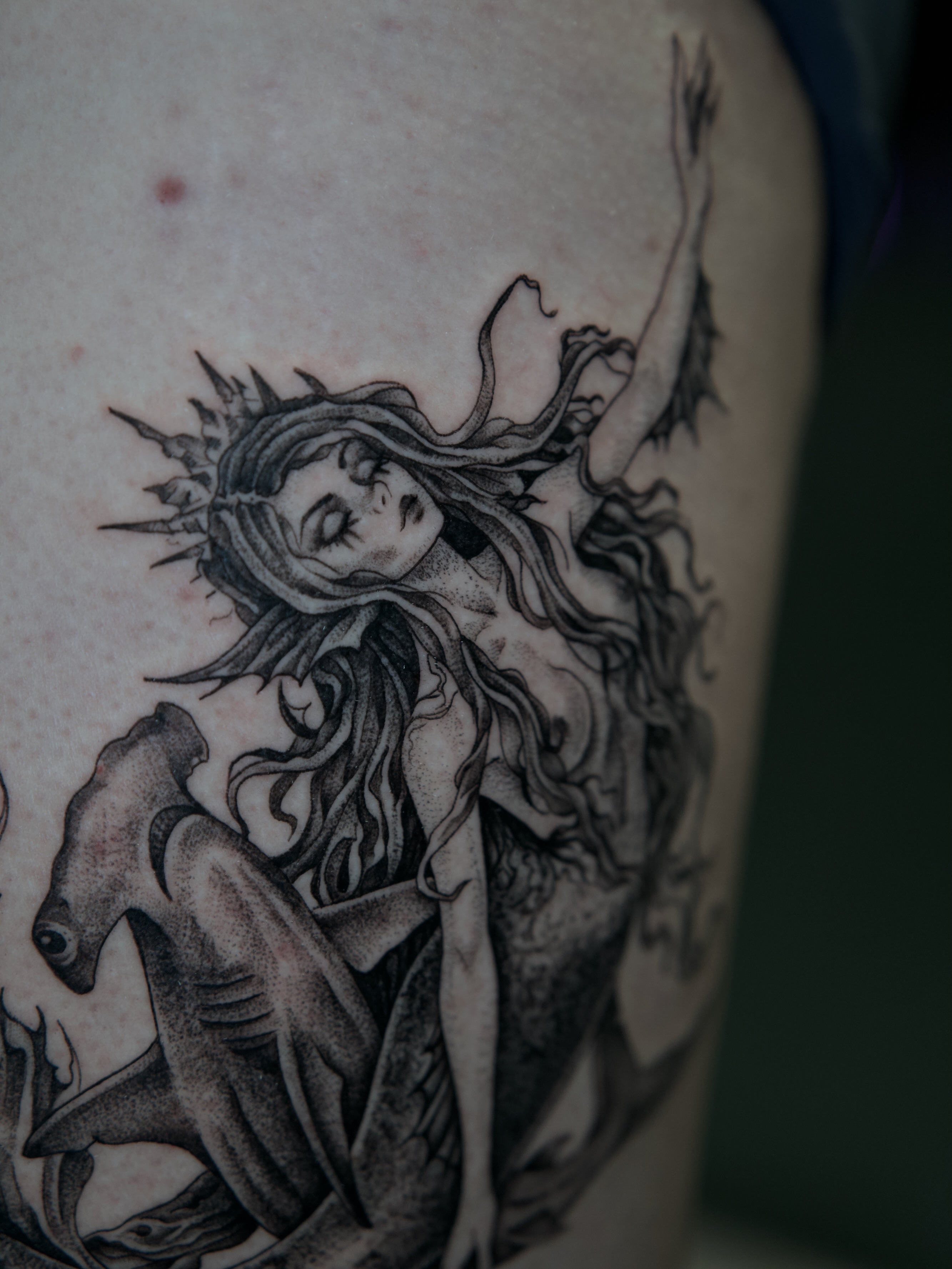 Mermaid dotwork tattoo on the thigh by Raven Wood