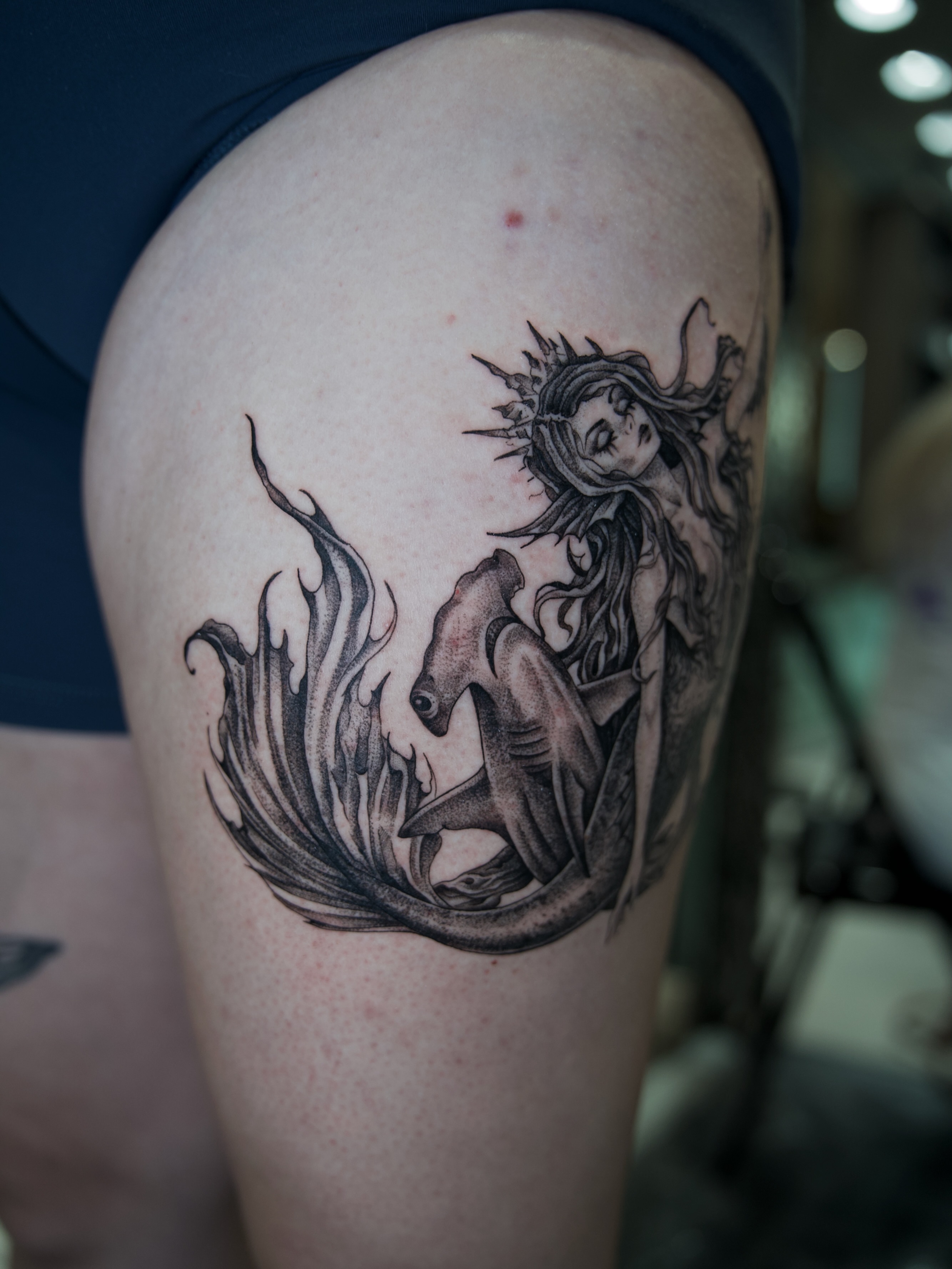 Mermaid black and grey tattoo on the thigh by Raven Wood