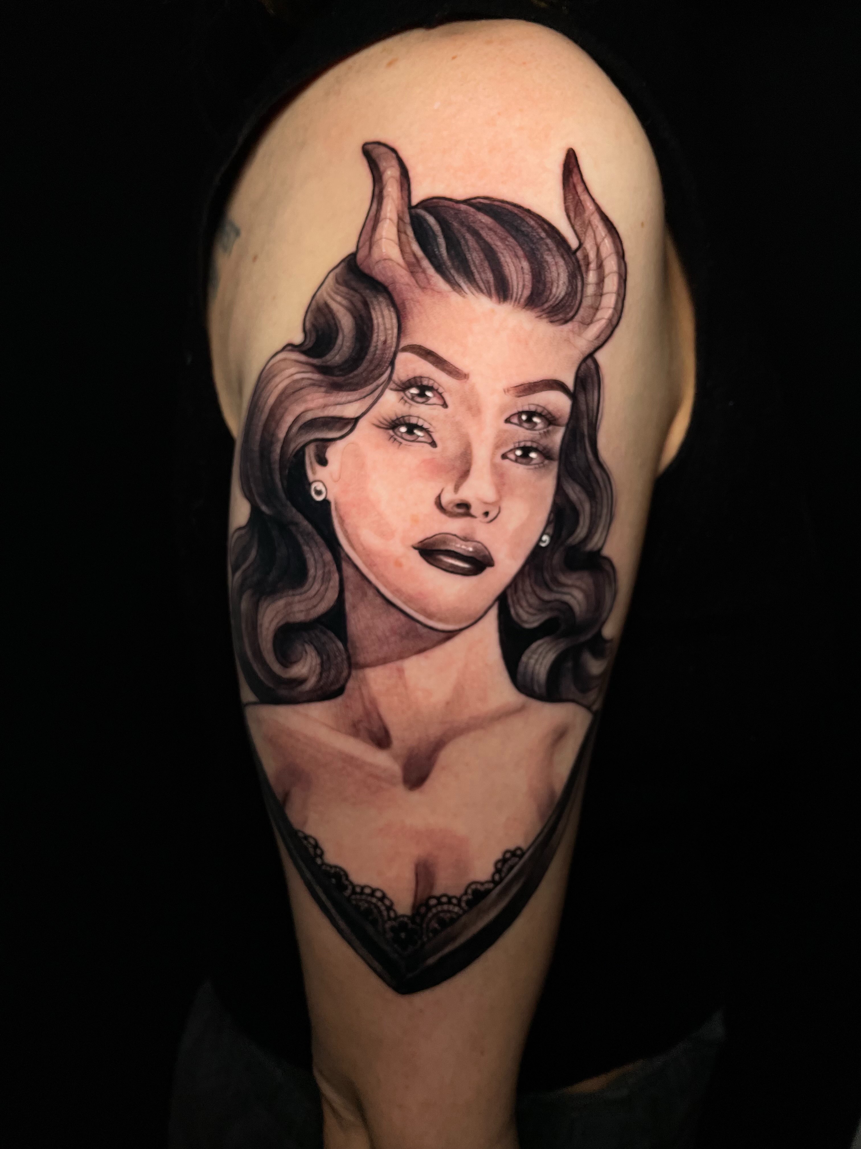 Woman with horns realism tattoo on the shoulder by Tanya Murski
