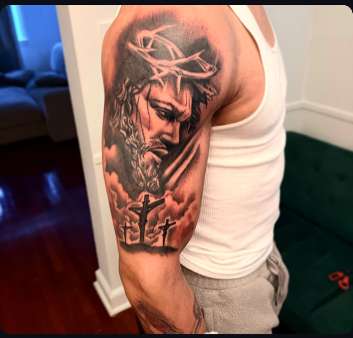 Religious figure realism tattoo on the upper arm by Lamb, Philadelphia, Pennsylvania