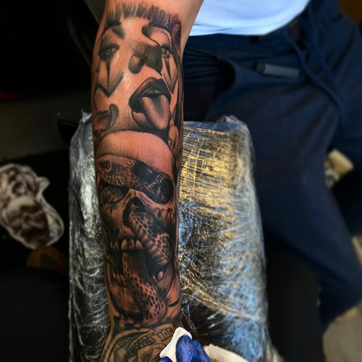 Skull and woman realism tattoo on the forearm by Lamb, Philadelphia, Pennsylvania
