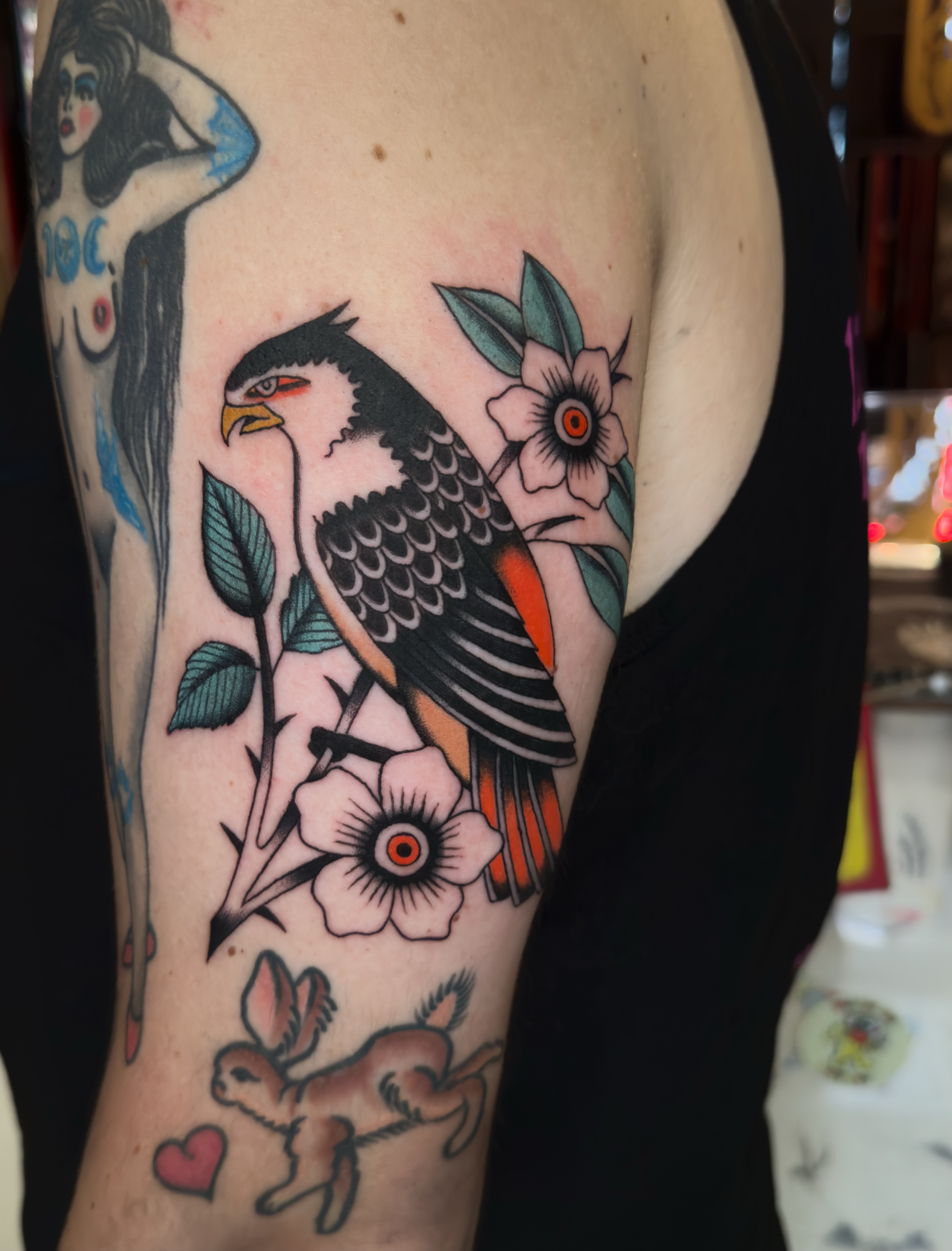 Bird and flowers American traditional tattoo on the forearm by Allie Barringer