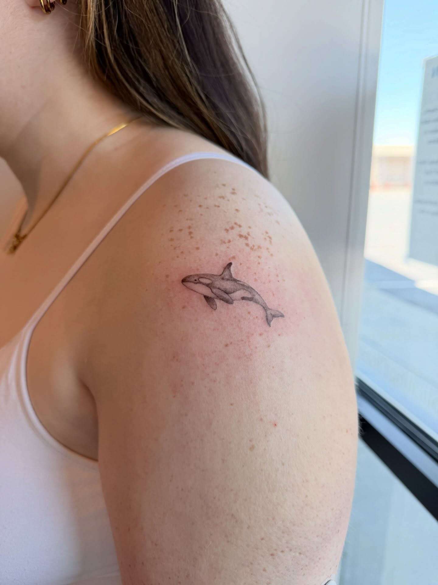 Orca realism tattoo on the shoulder by Reverie Studio