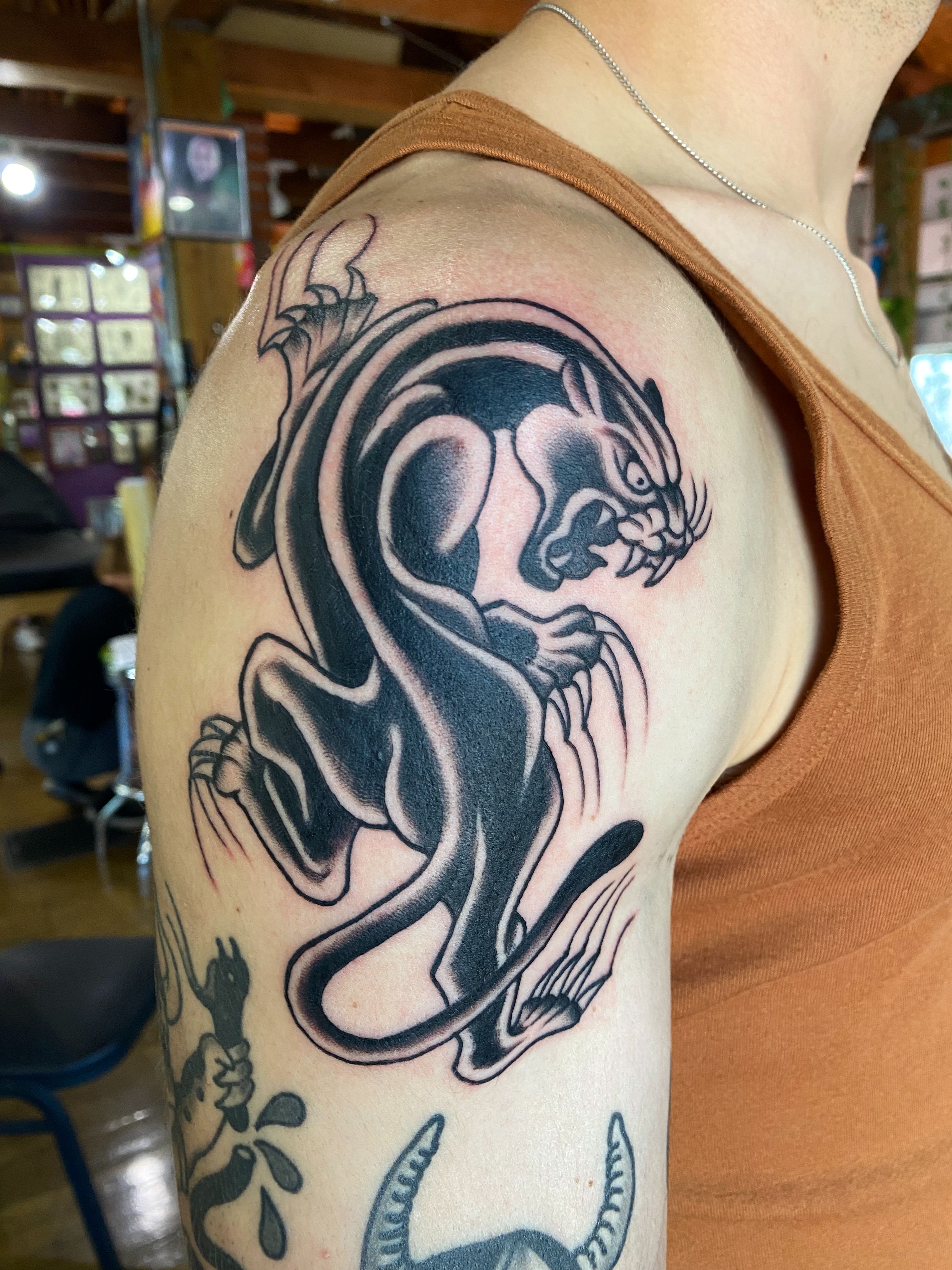 Panther American traditional tattoo on the shoulder by Karl Hegwein, Portland, Oregon