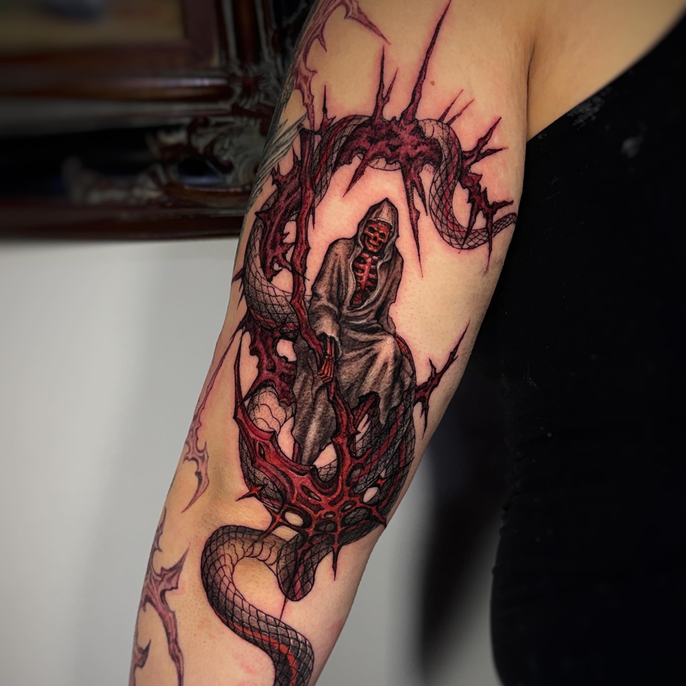 Grim reaper dark realism tattoo on the forearm by Jemin Ren