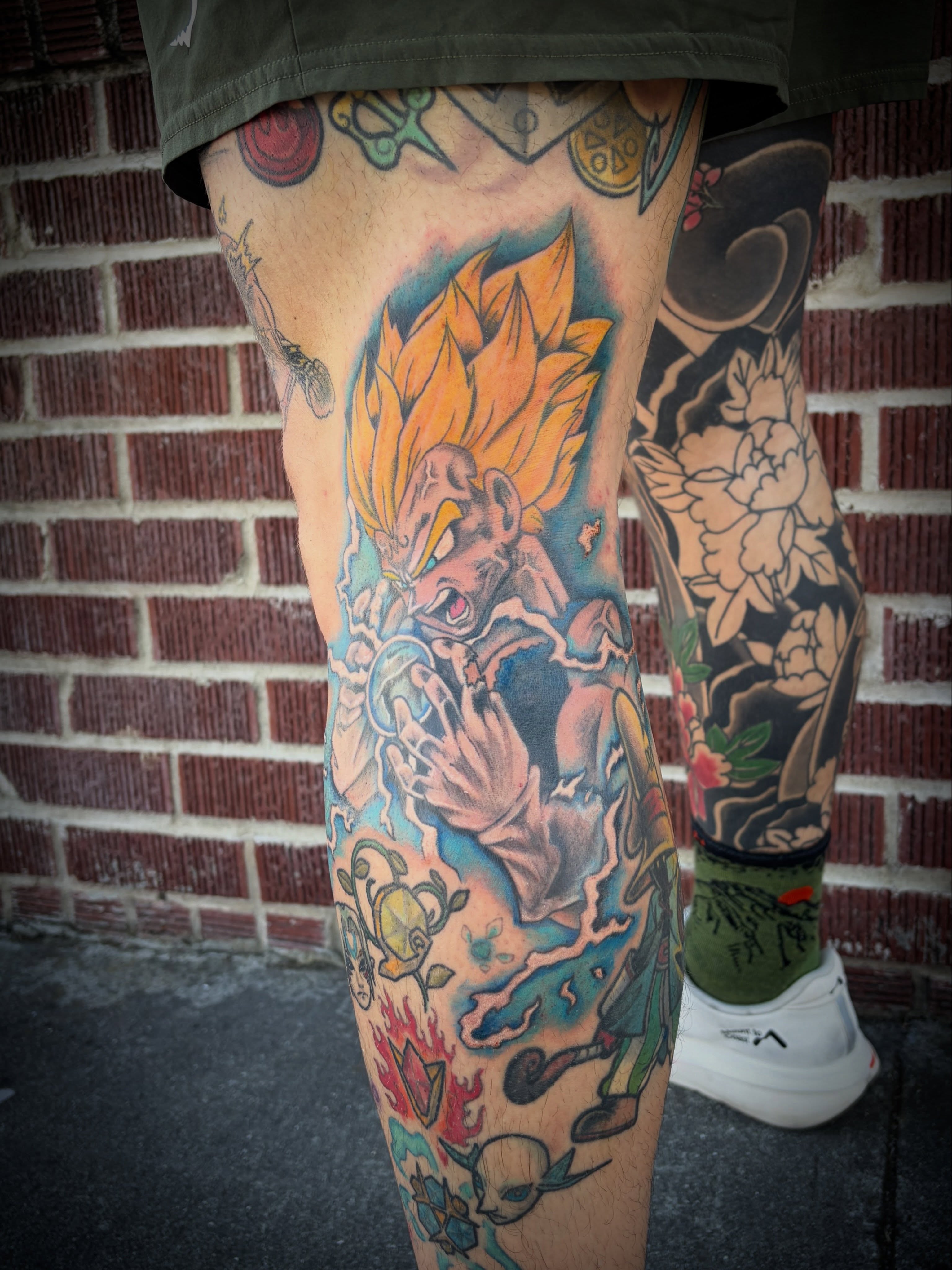 Super Saiyan anime tattoo on the thigh by Laura