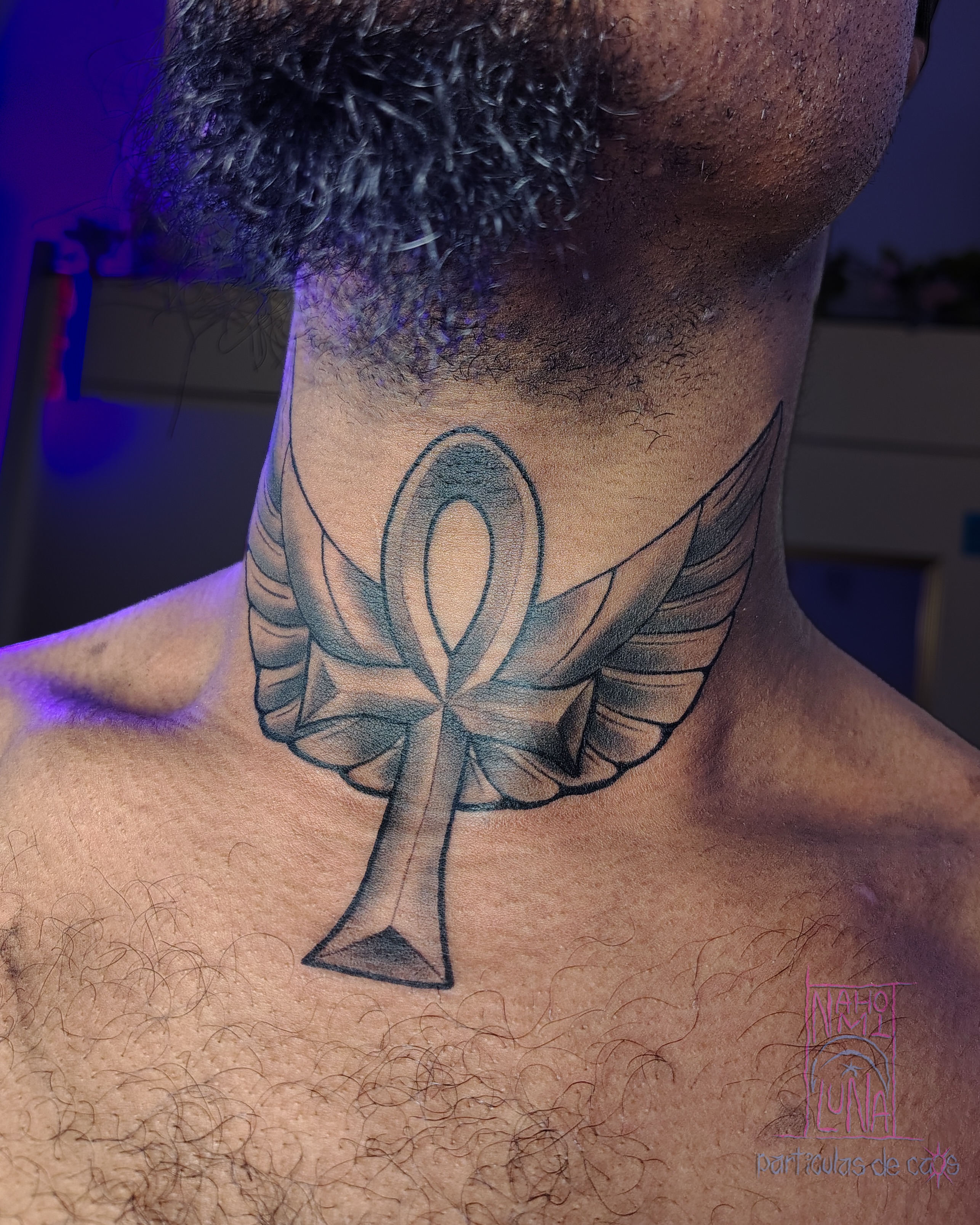 Ankh with wings black and grey tattoo on the neck by Nahomi Luna - Memphis & Cordova Tattoo, Memphis, Tennessee
