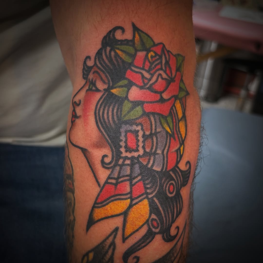 Woman with rose American traditional tattoo on the forearm by Deya Aven, Nashville, Tennessee