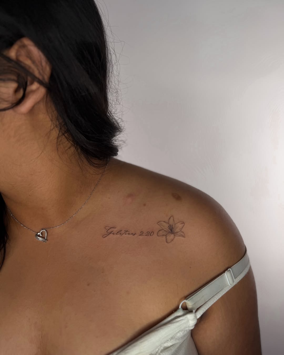 Lily black and grey tattoo on the shoulder by Fineline Tattoos DFW