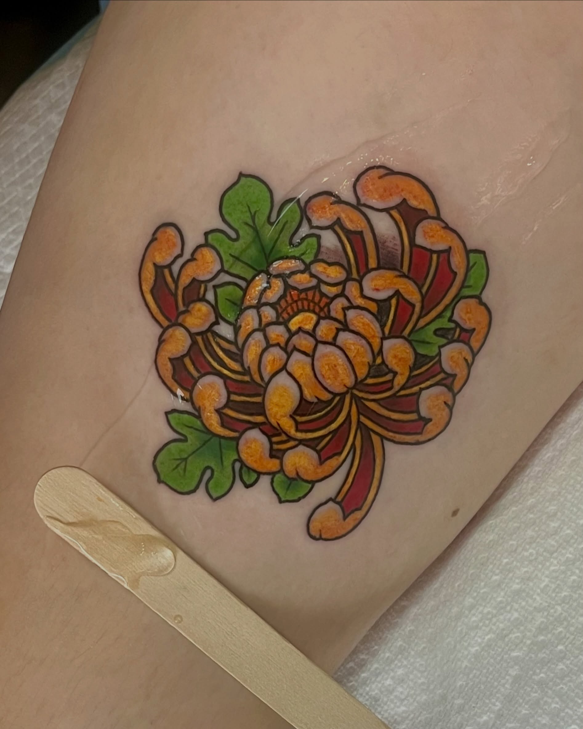 Chrysanthemum japanese irezumi tattoo on the thigh by EO, Chicago, Illinois