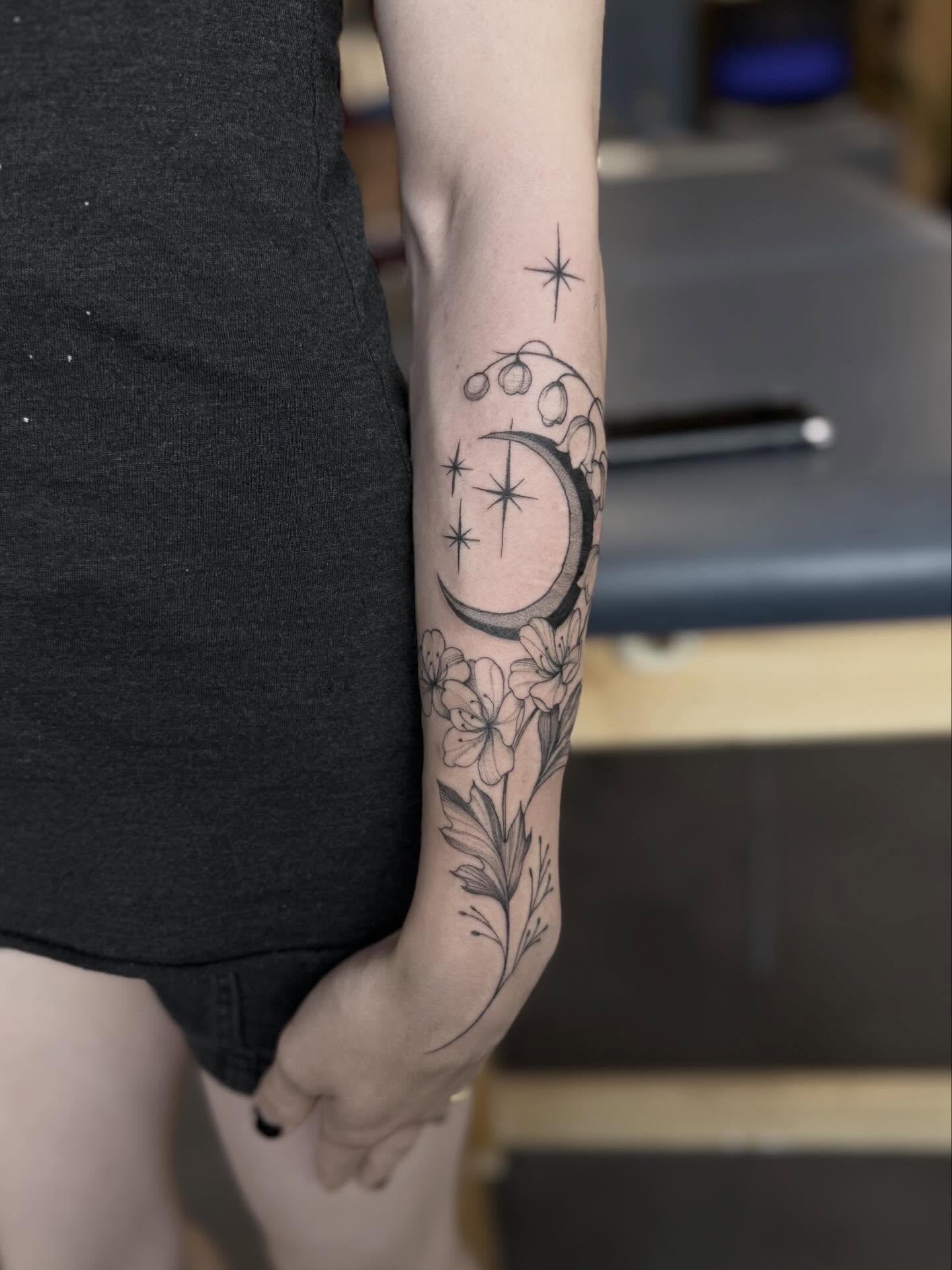 Moon and flowers black and grey tattoo on the forearm by Peter Harren