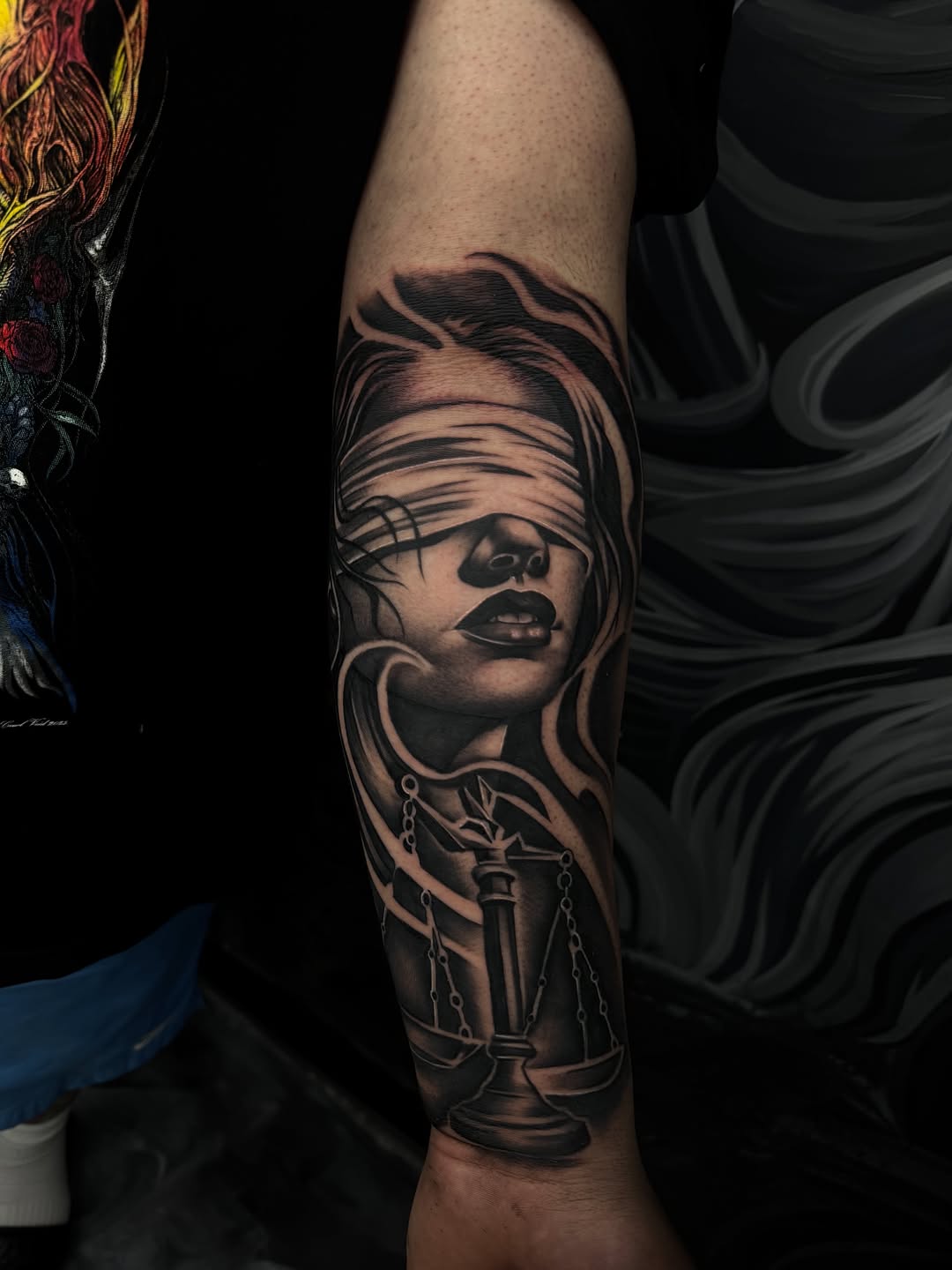 Blindfolded woman and scales of justice realism tattoo on the forearm by Frank “ghost” Git2💉