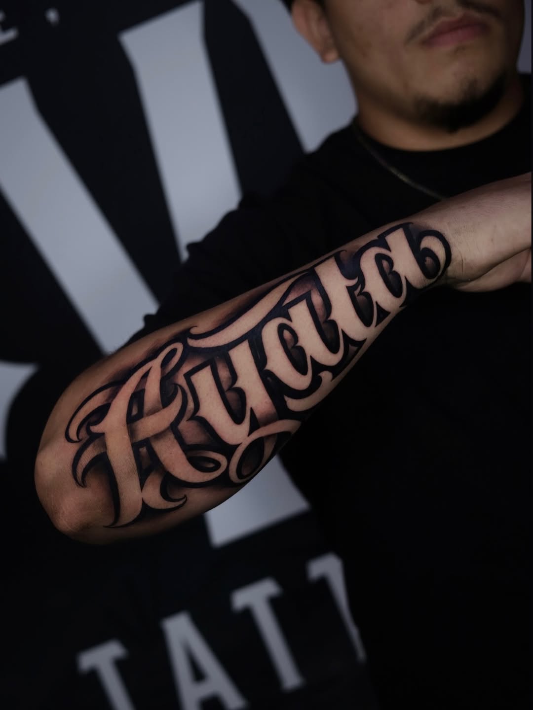 Tattoo by @tatts_by_ant — lettering_script, chicano