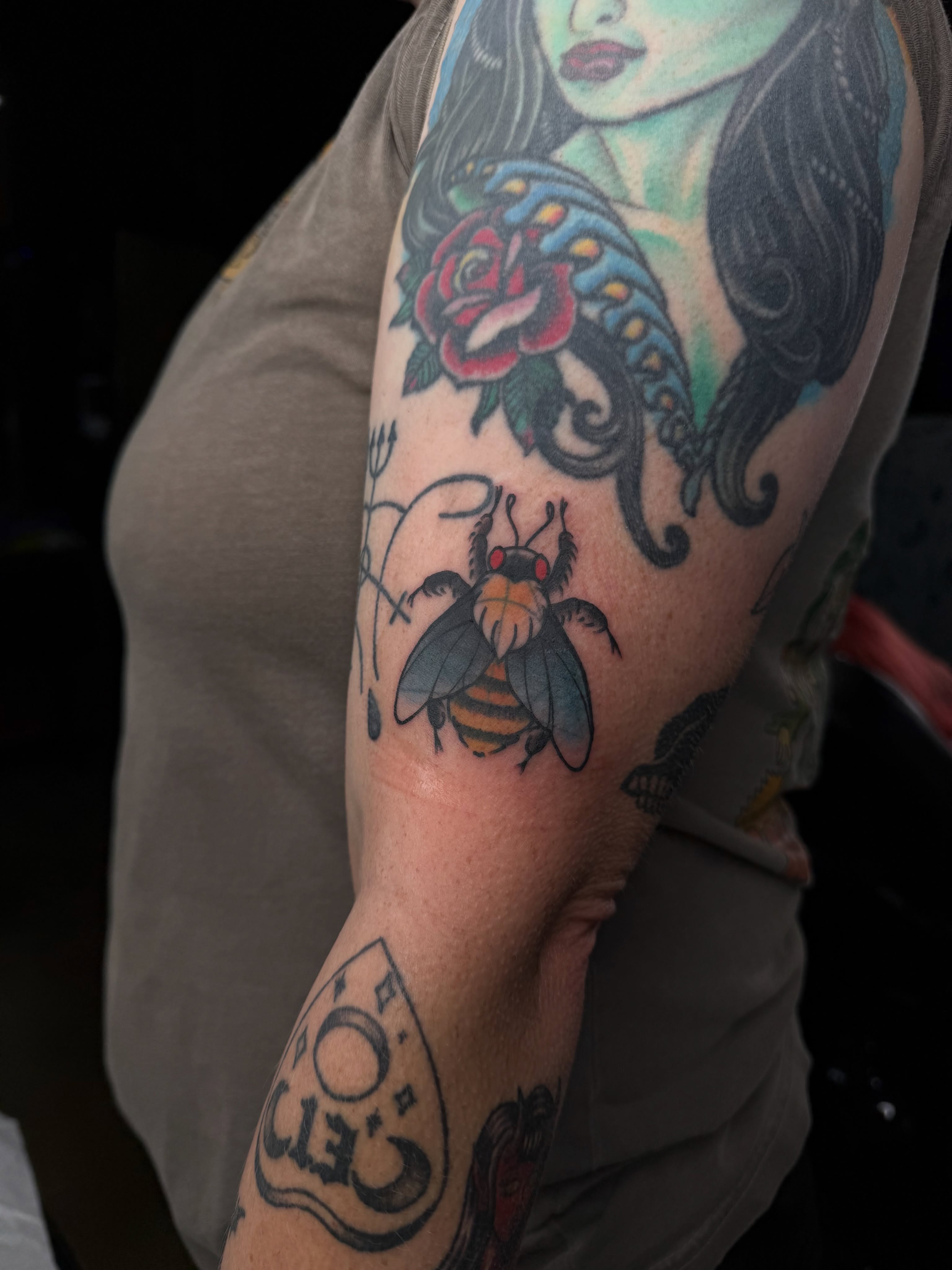 Bee and rose American traditional tattoo on the forearm by Mercy Dean