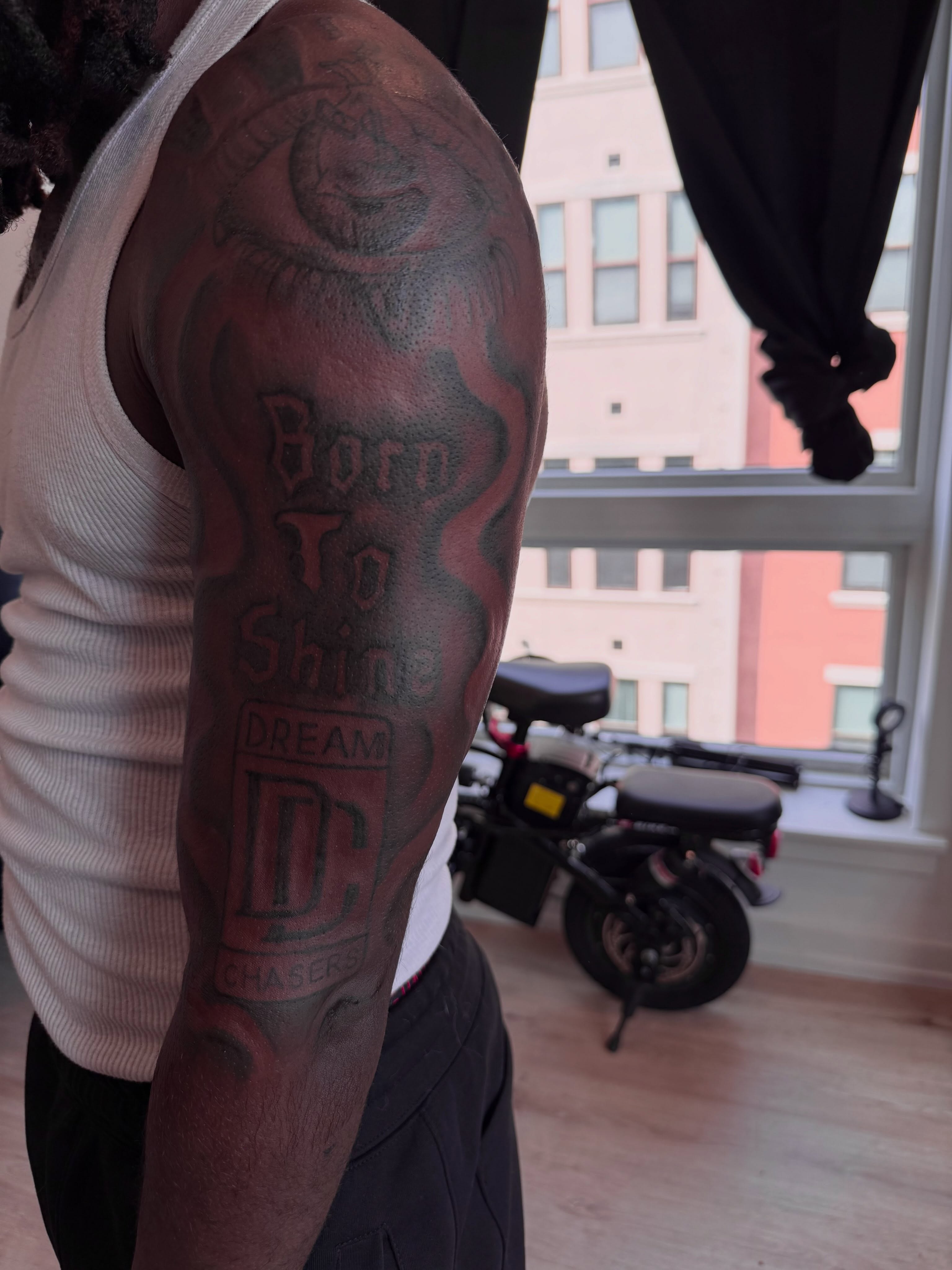 DC Dream Chasers dotwork tattoo on the upper arm by inkedbylii, Philadelphia, Pennsylvania