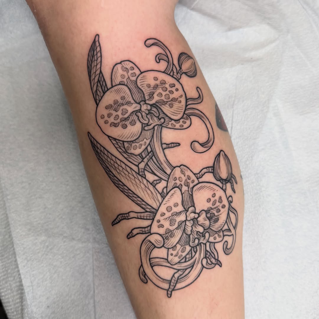 Orchids black and grey tattoo on the forearm by Taylor 🍂☕️