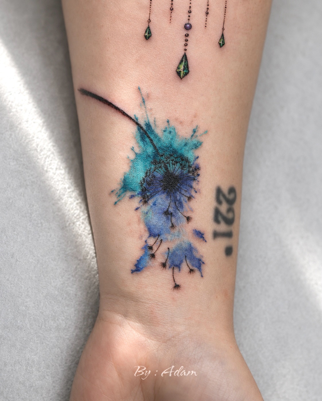 Dandelion watercolor tattoo on the forearm by Adam_Zhiwei Xu(Tattooist)