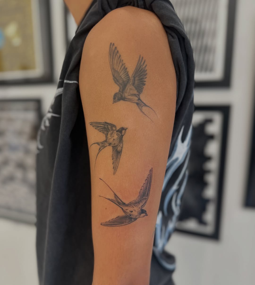 Swallows black and grey tattoo on the forearm by Ric Castellon Tattoo Artist, Los Angeles, California