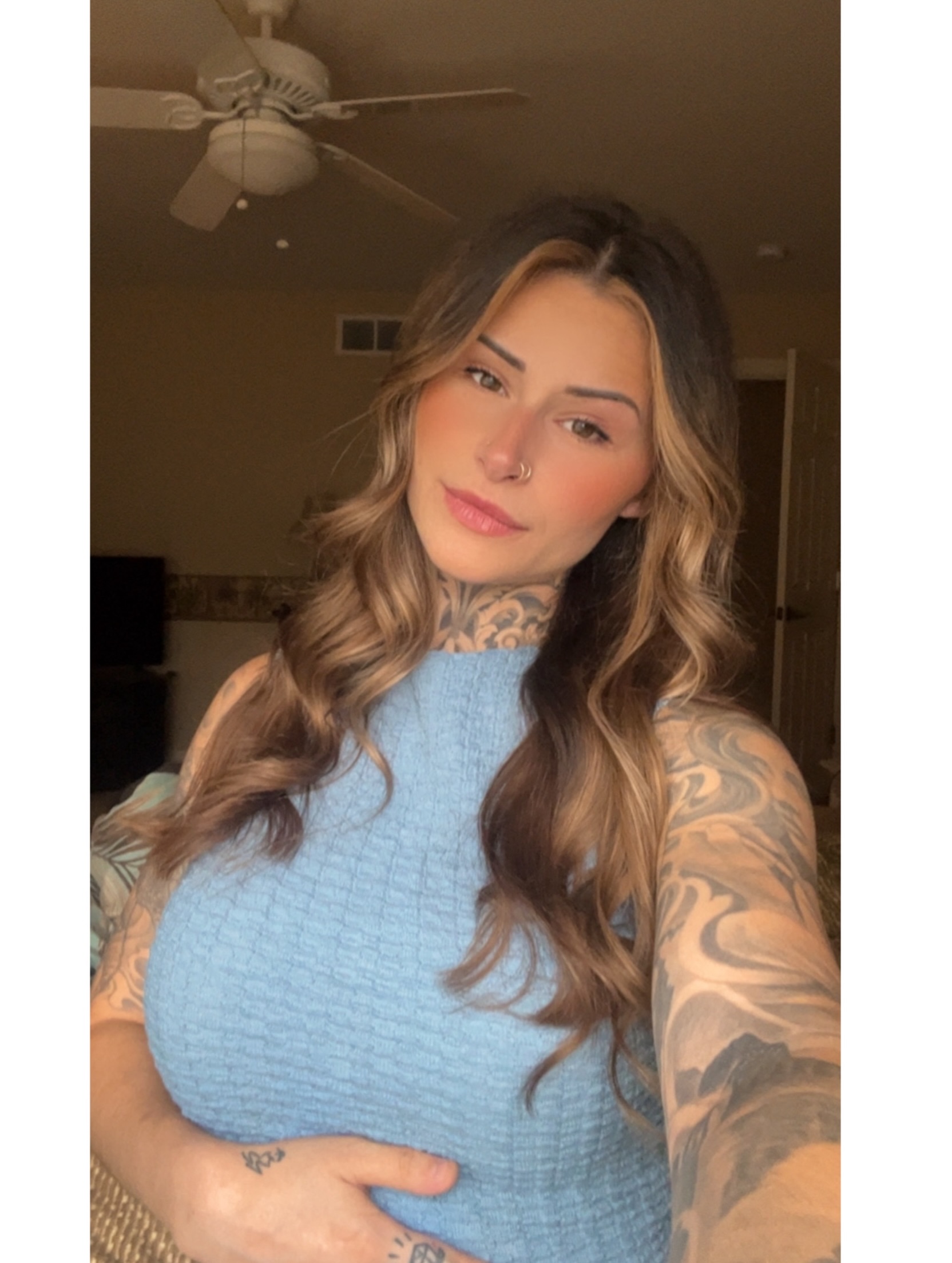 Tattooed neck and arm black and grey tattoo on the upper arm by Jordyn Tinney