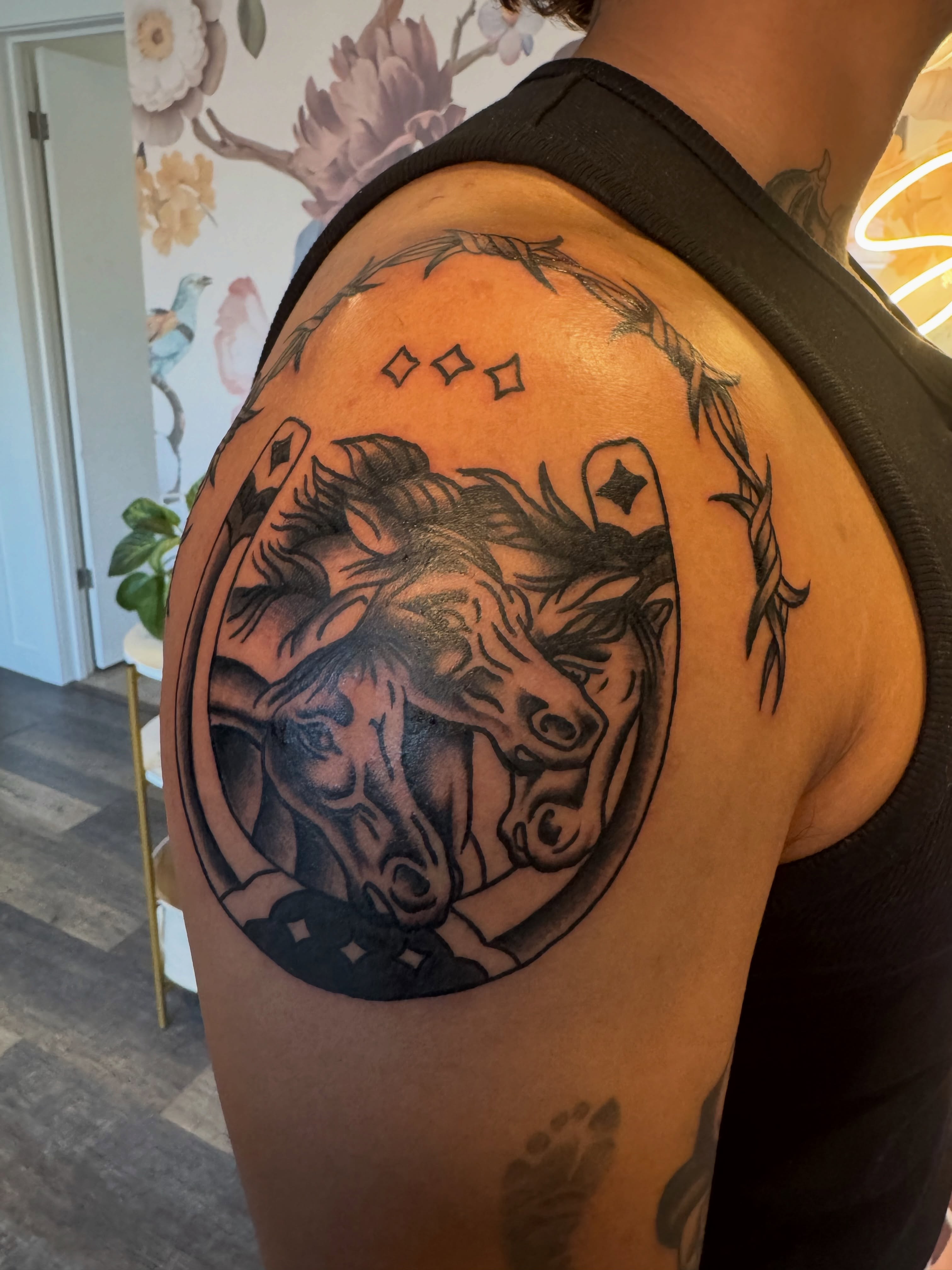 Horses black and grey tattoo on the shoulder by Kinzi Brown