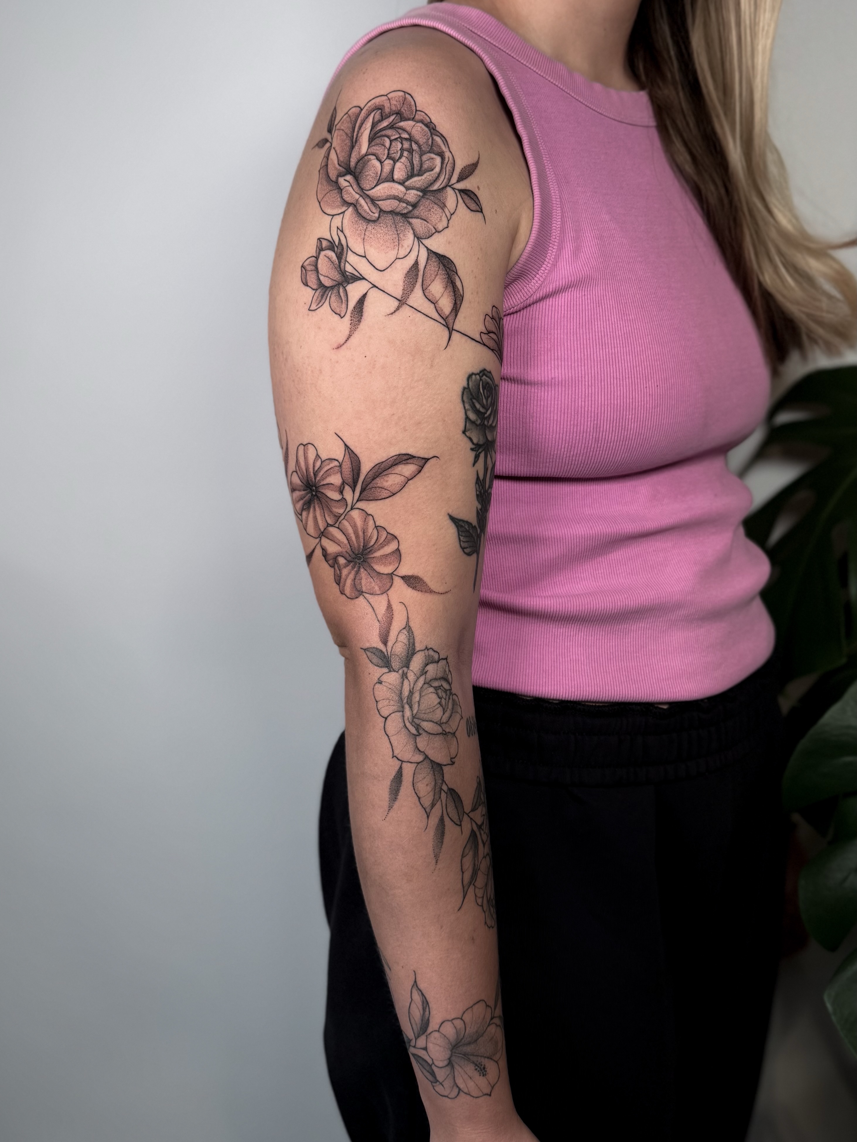 Floral bouquet black and grey tattoo on the forearm by Jessica Bloom