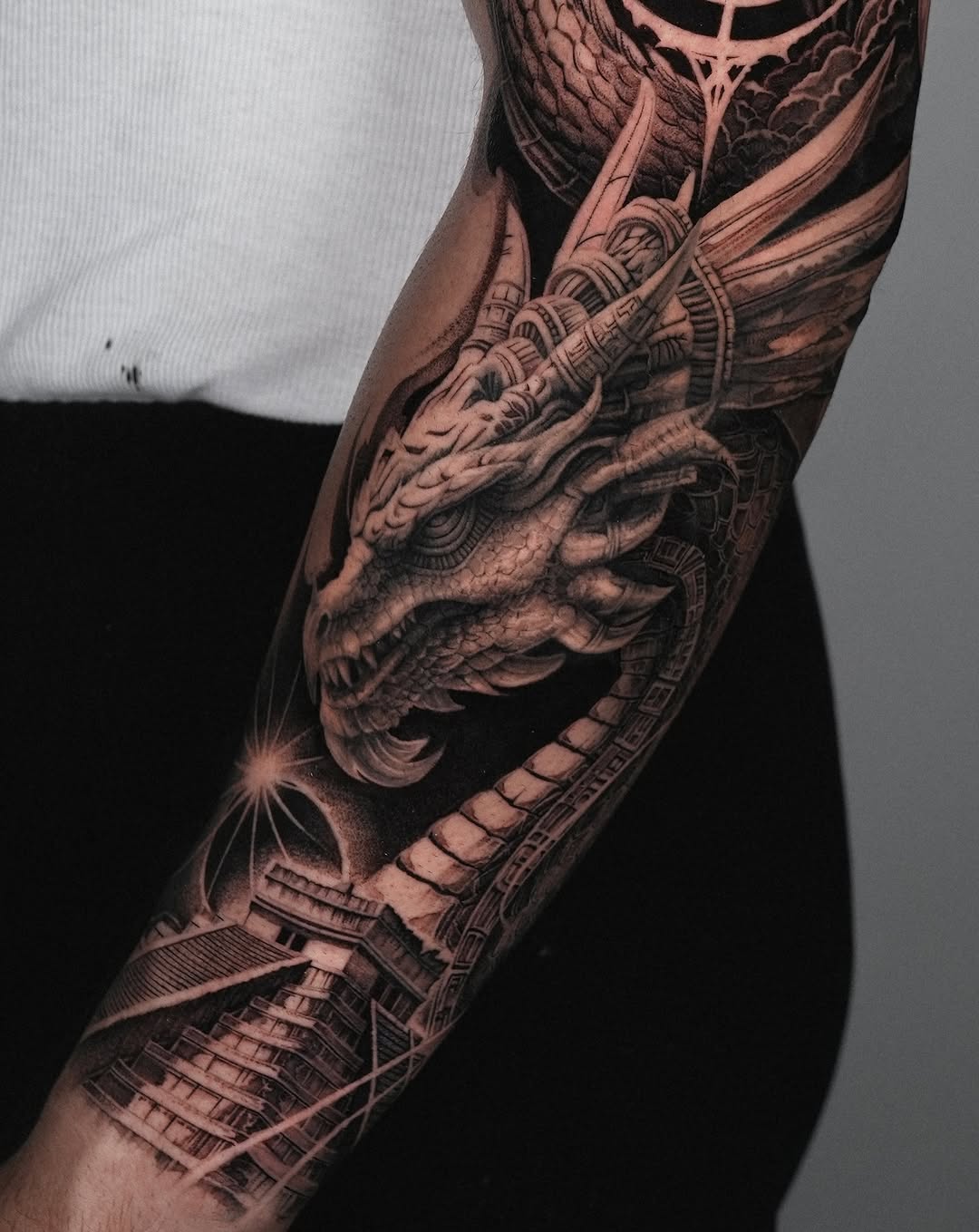 Dragon head and pyramid Japanese tattoo on the forearm by Sumok Kim