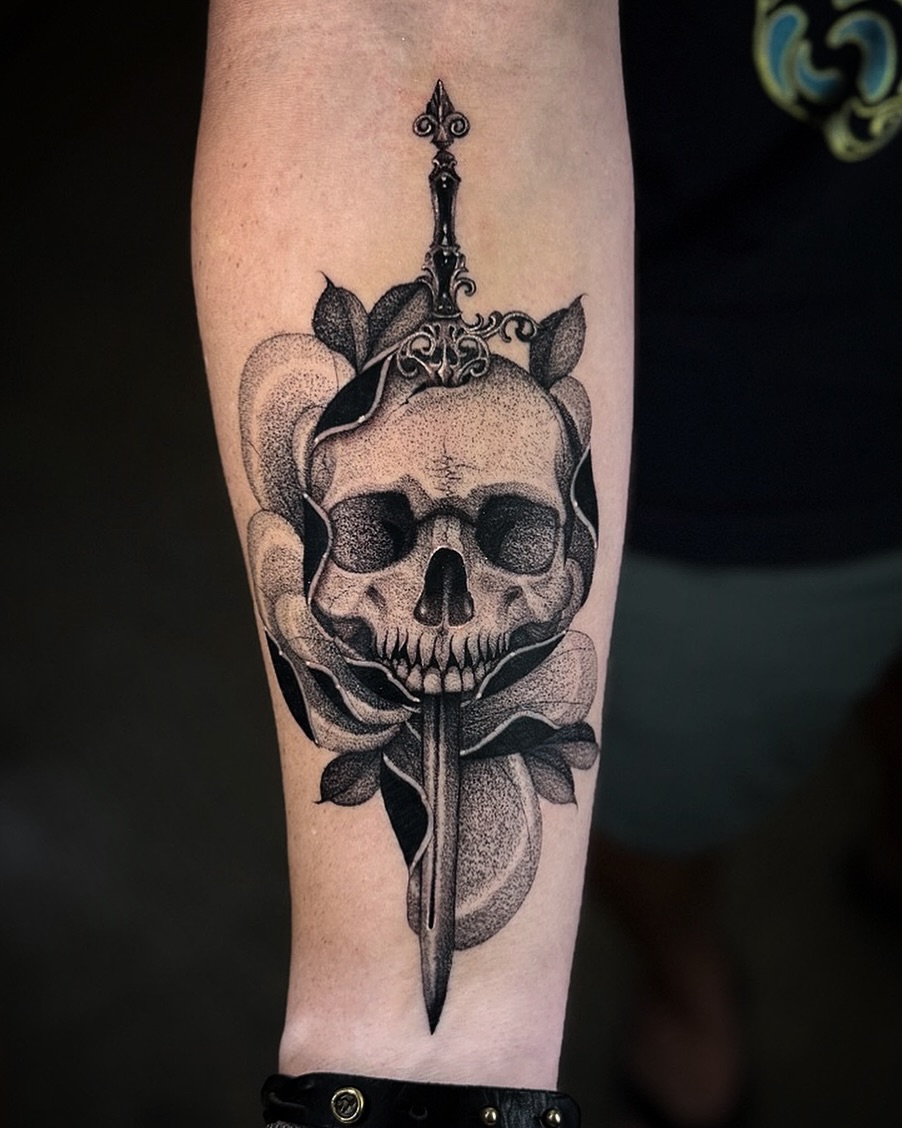 Skull and dagger dotwork tattoo on the forearm by miami tattoo artist