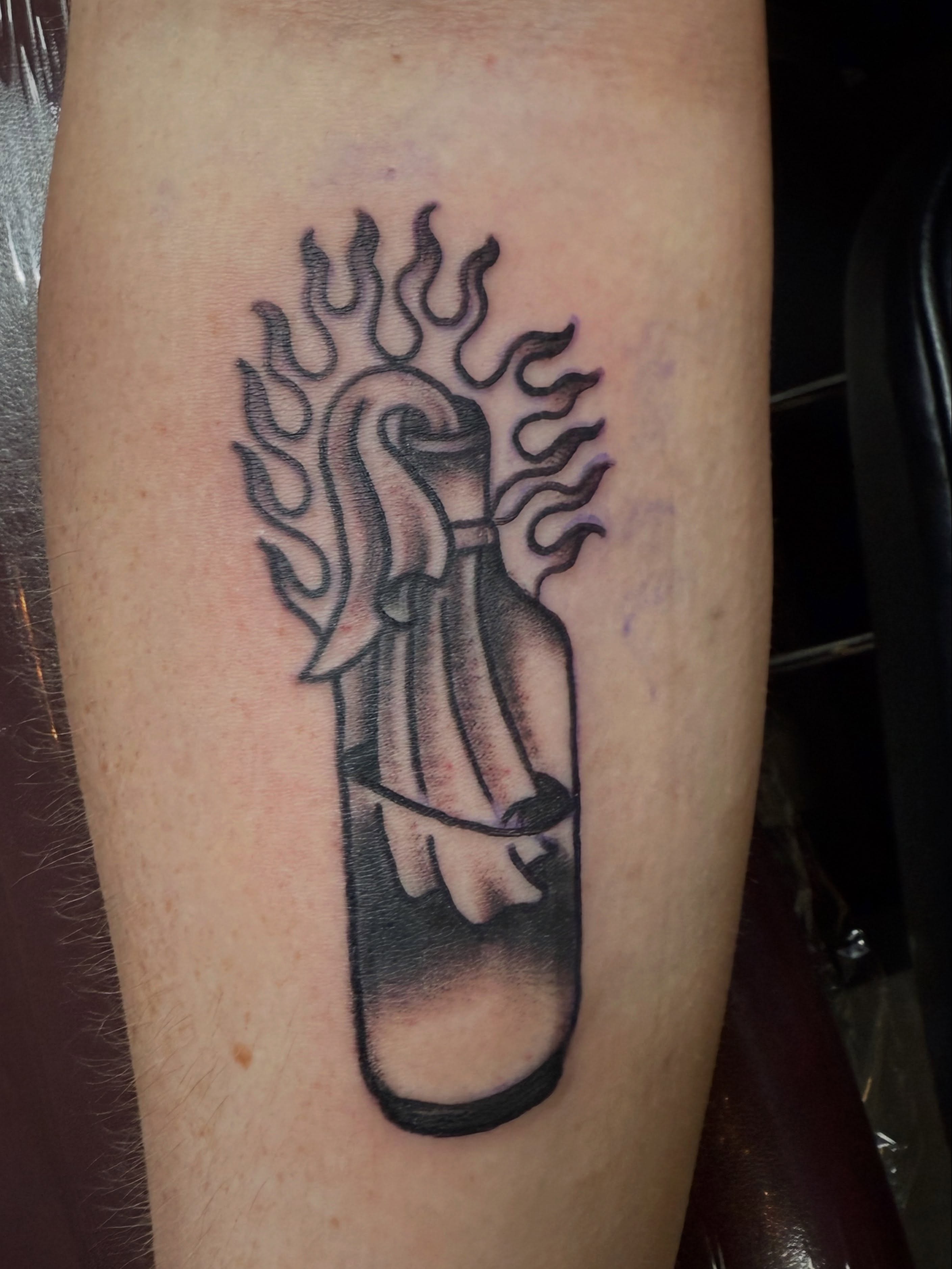 Flame and violin black and grey tattoo on the forearm by Arron Albaugh