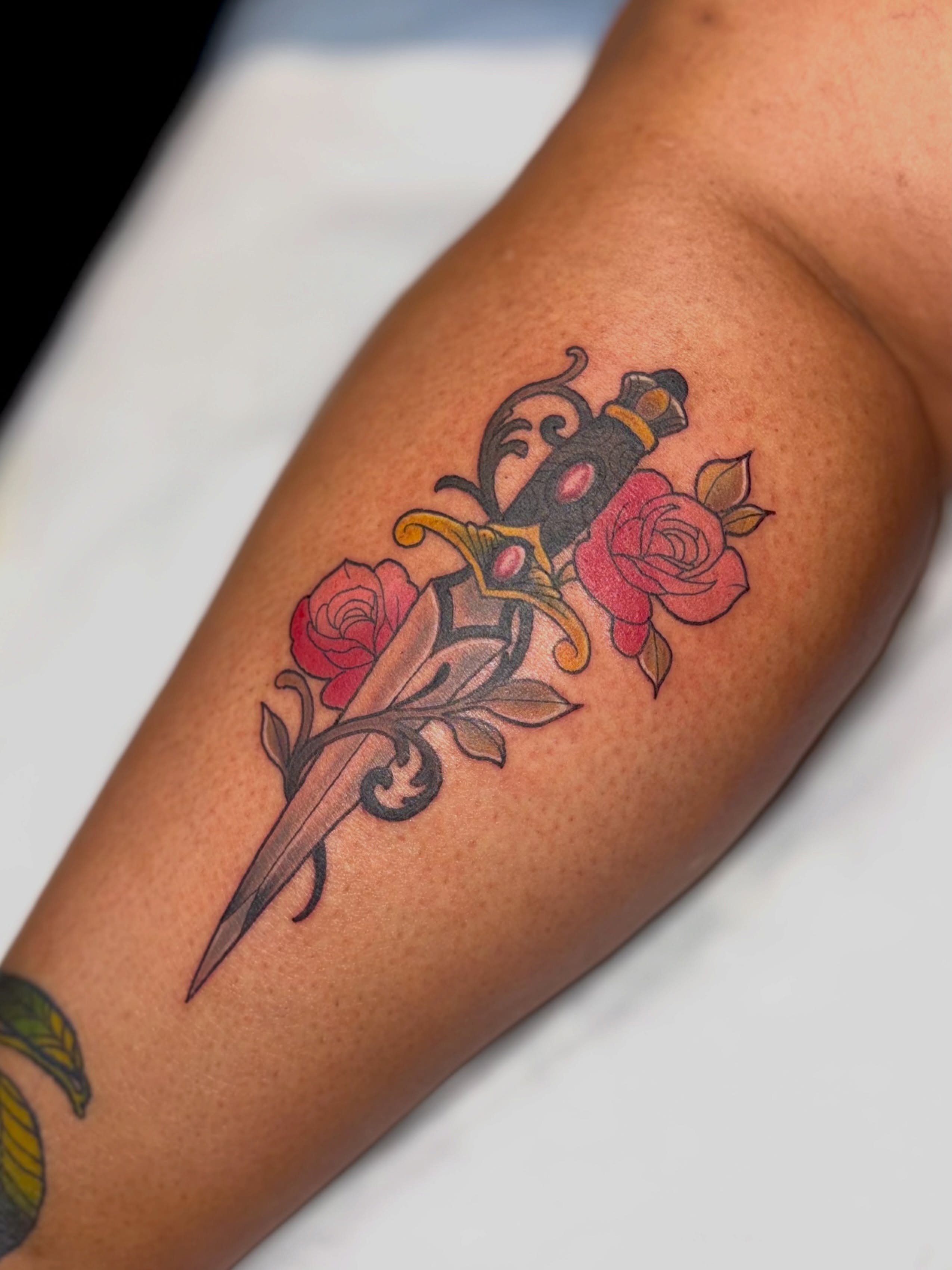 Sword and roses American traditional tattoo on the forearm by Kyndall Lynn, Waxahachie, Texas