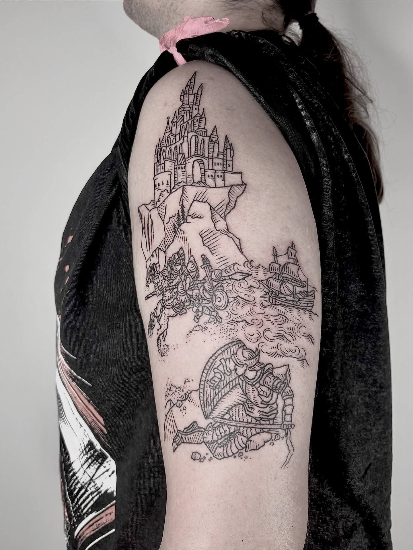 Castle and sea battle realism tattoo on the upper arm by <3 eve’s tattoos <3